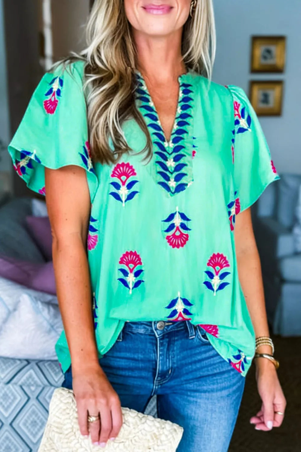 Turquoise floral V neck flutter sleeve blouse back view