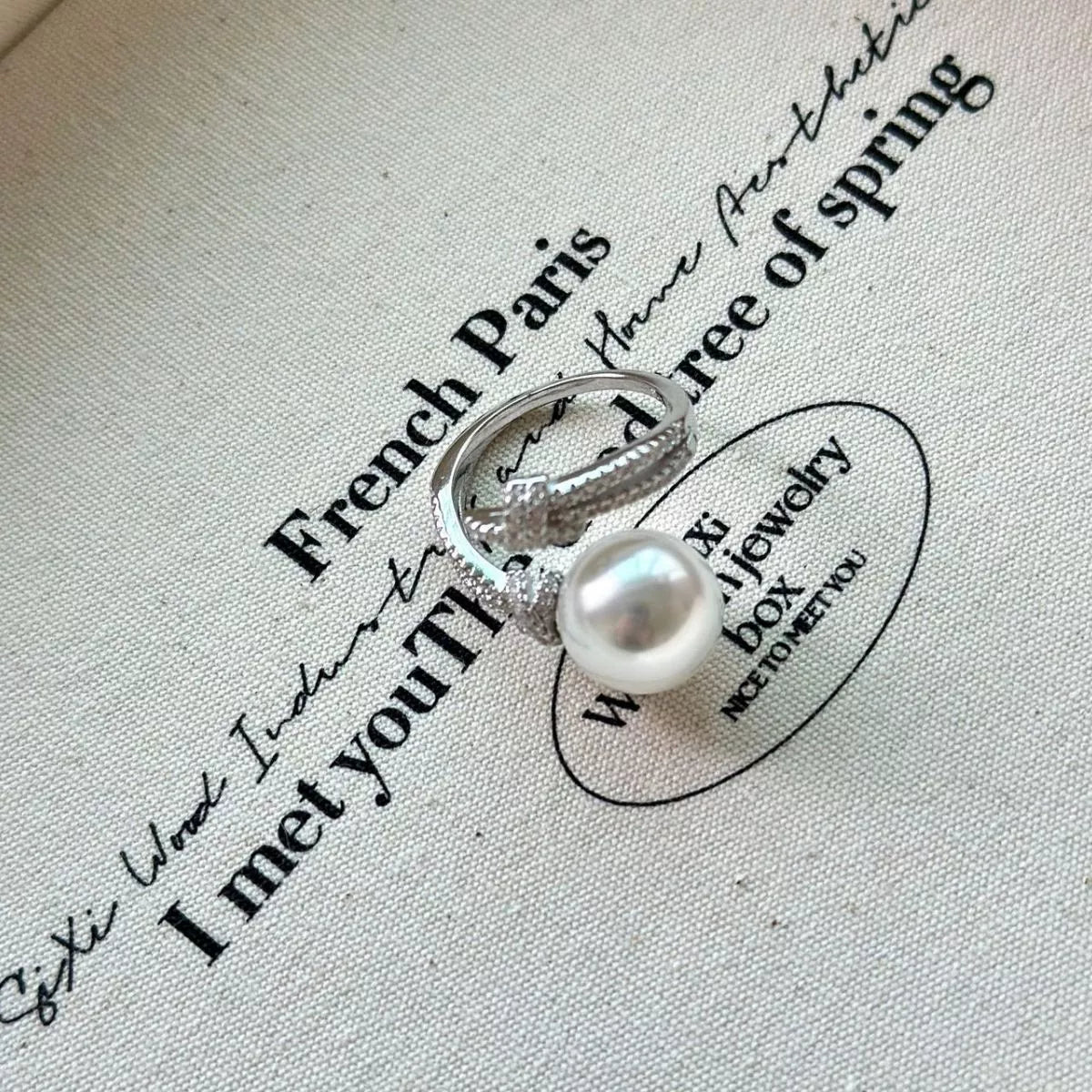pearl and zircon bypass ring in sterling silver angled view