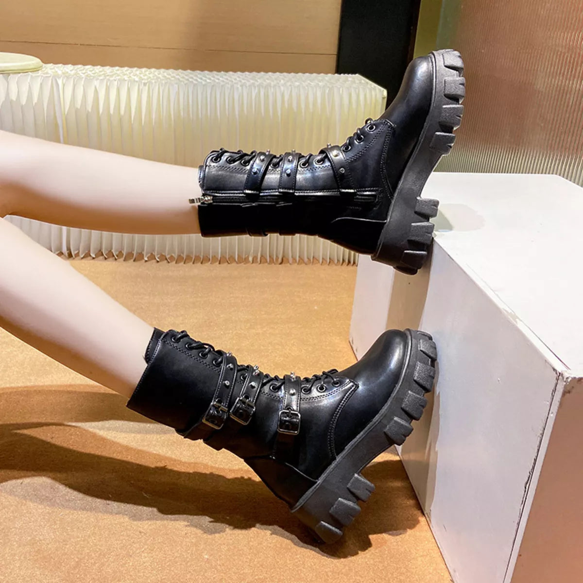 Buckled lace up combat boots heel and sole detail