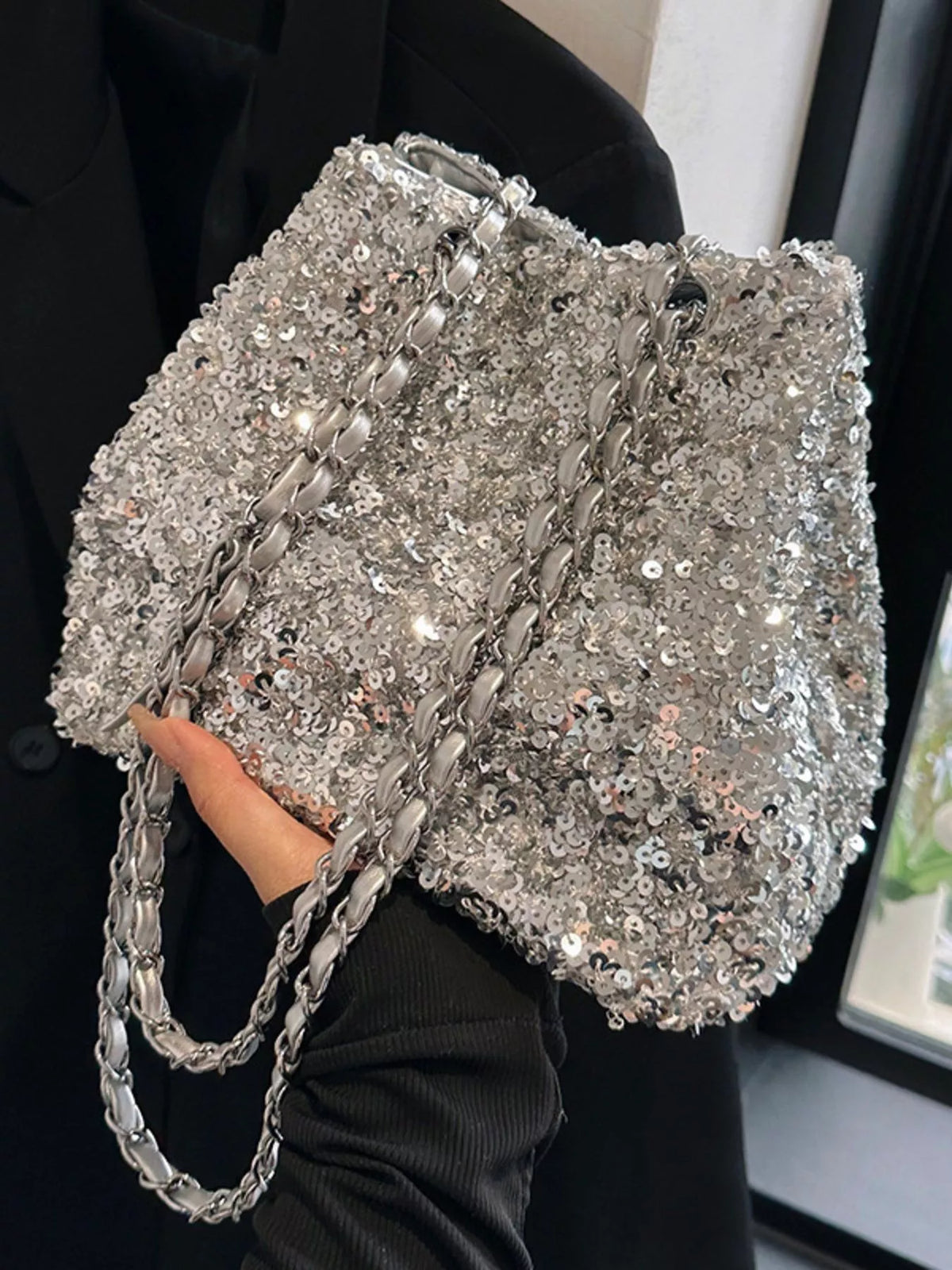 Sequin bucket bag drawstring top detail