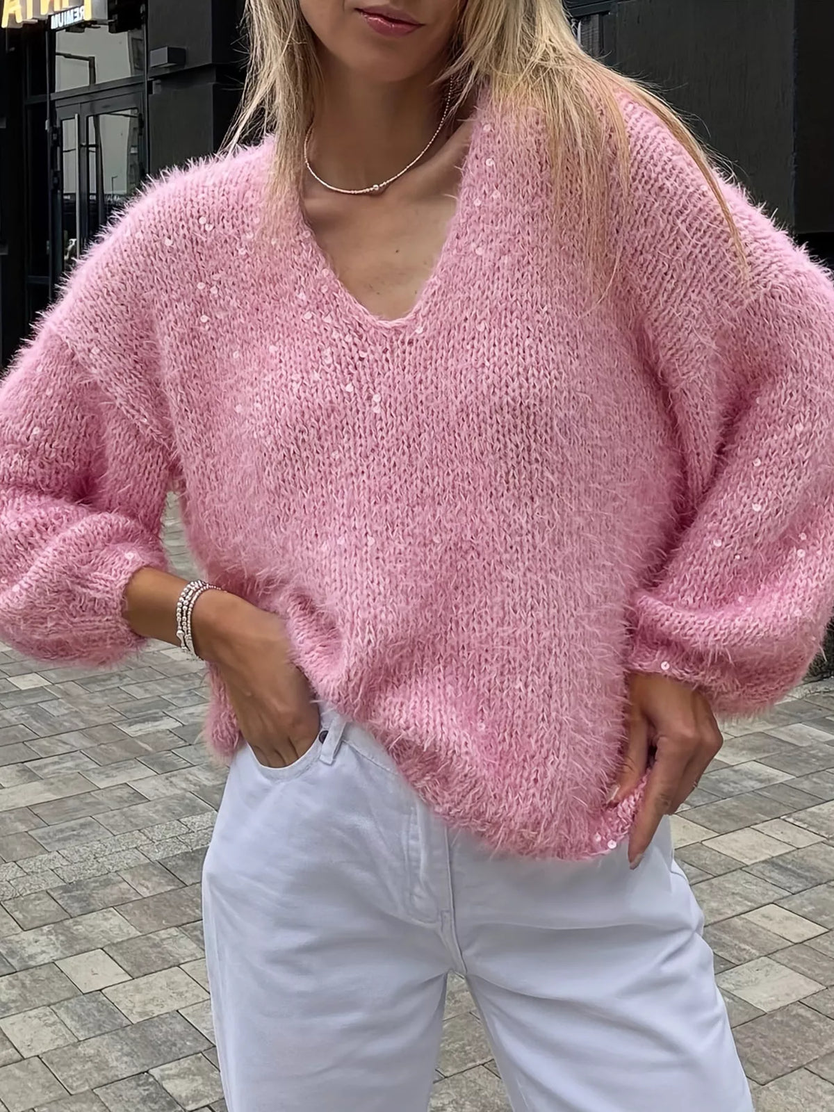 Pink sparkly fuzzy V neck knit top front view