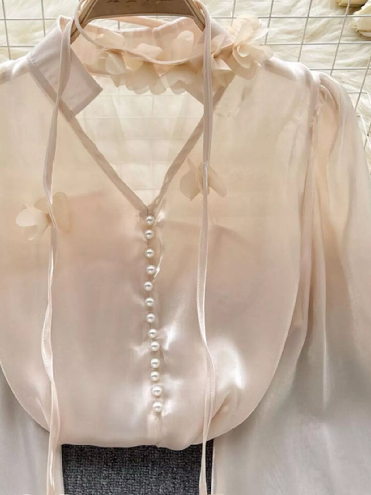 Close view of the sheer polyester fabric and florals