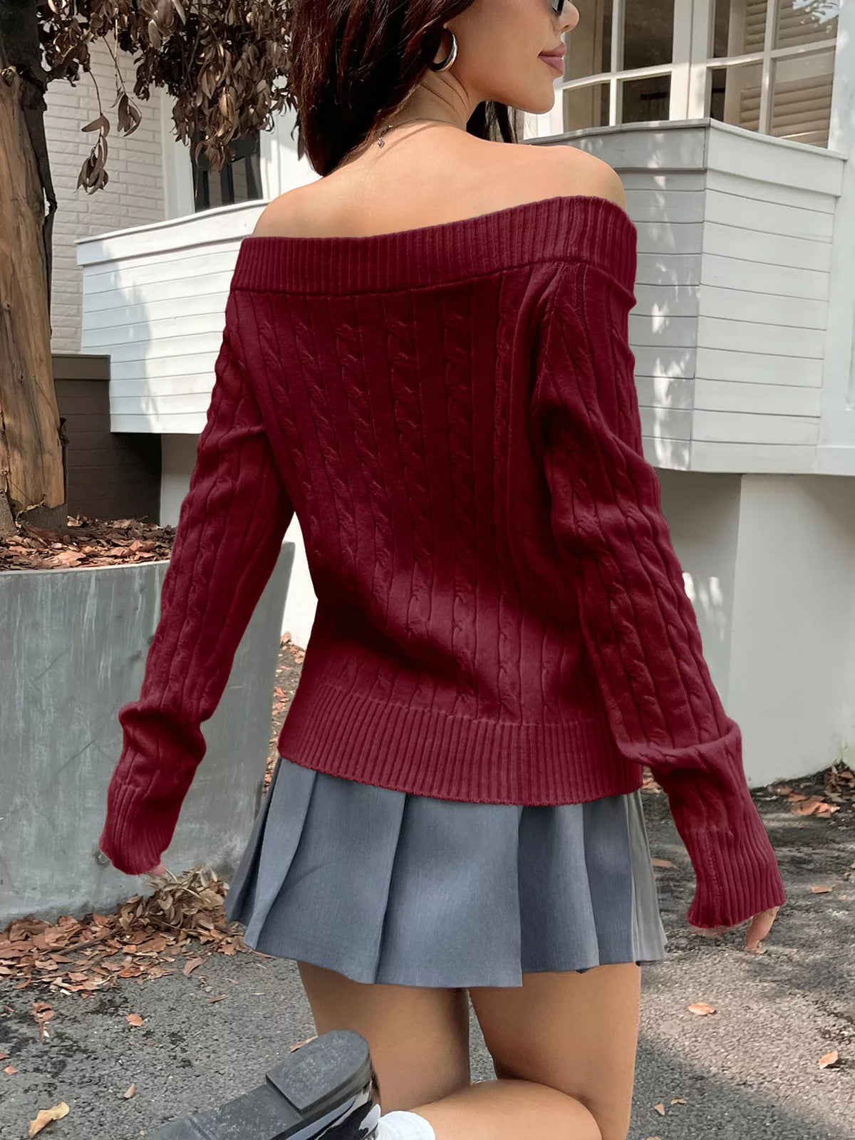 off shoulder cable knit sweater hem detail