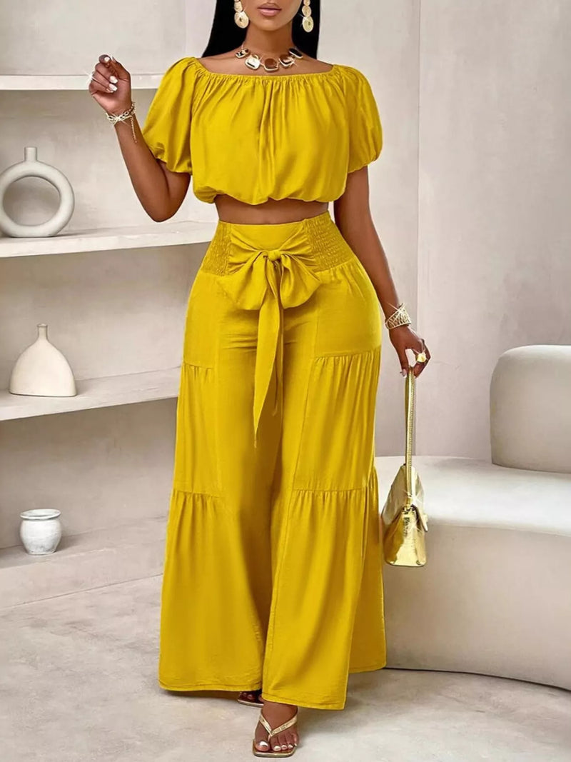 Mustard off shoulder crop top and ruched pants set front view