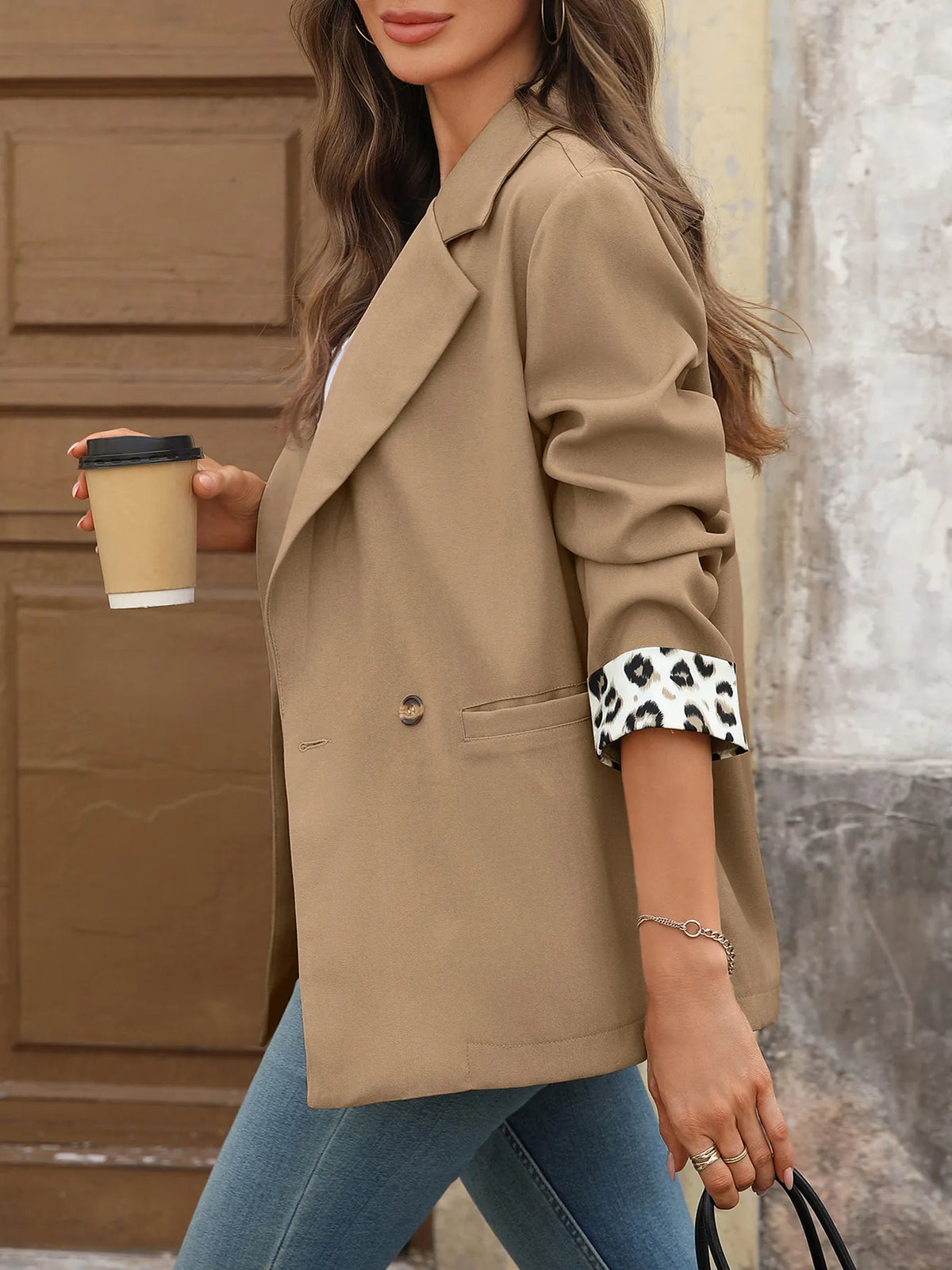 Blazer worn open over a blouse