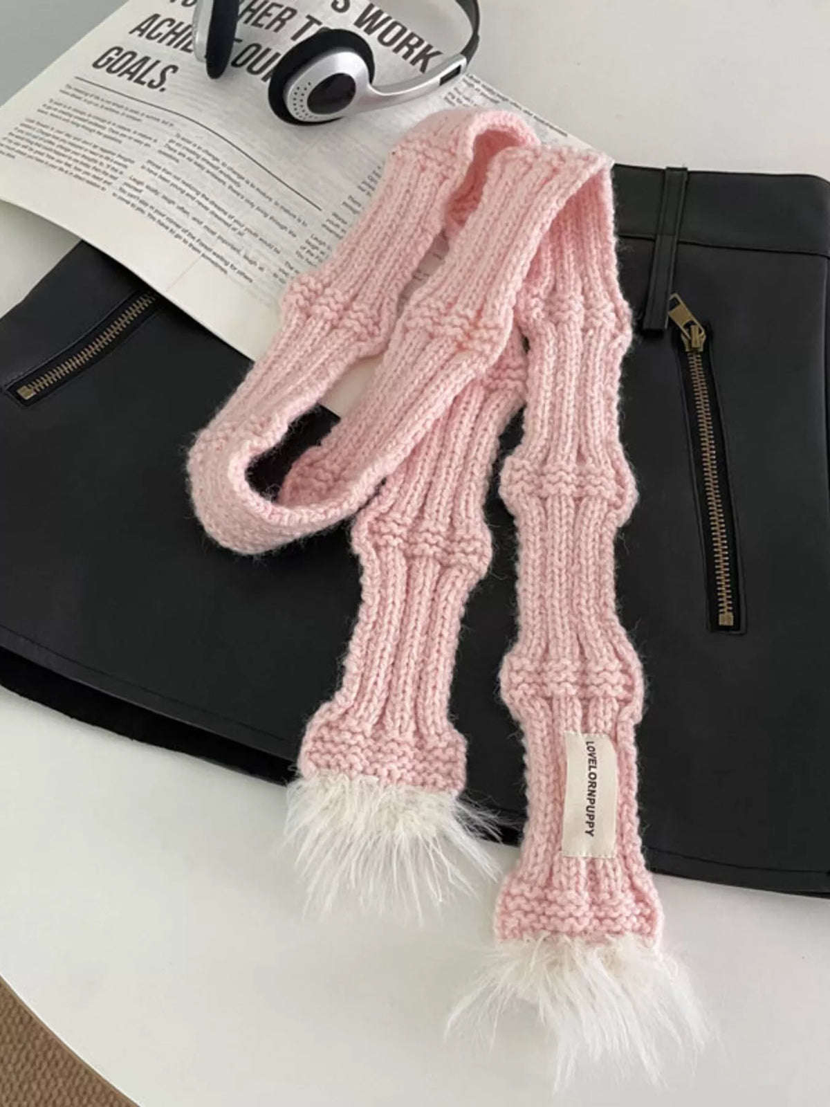Plush trim scarf draped over shoulder