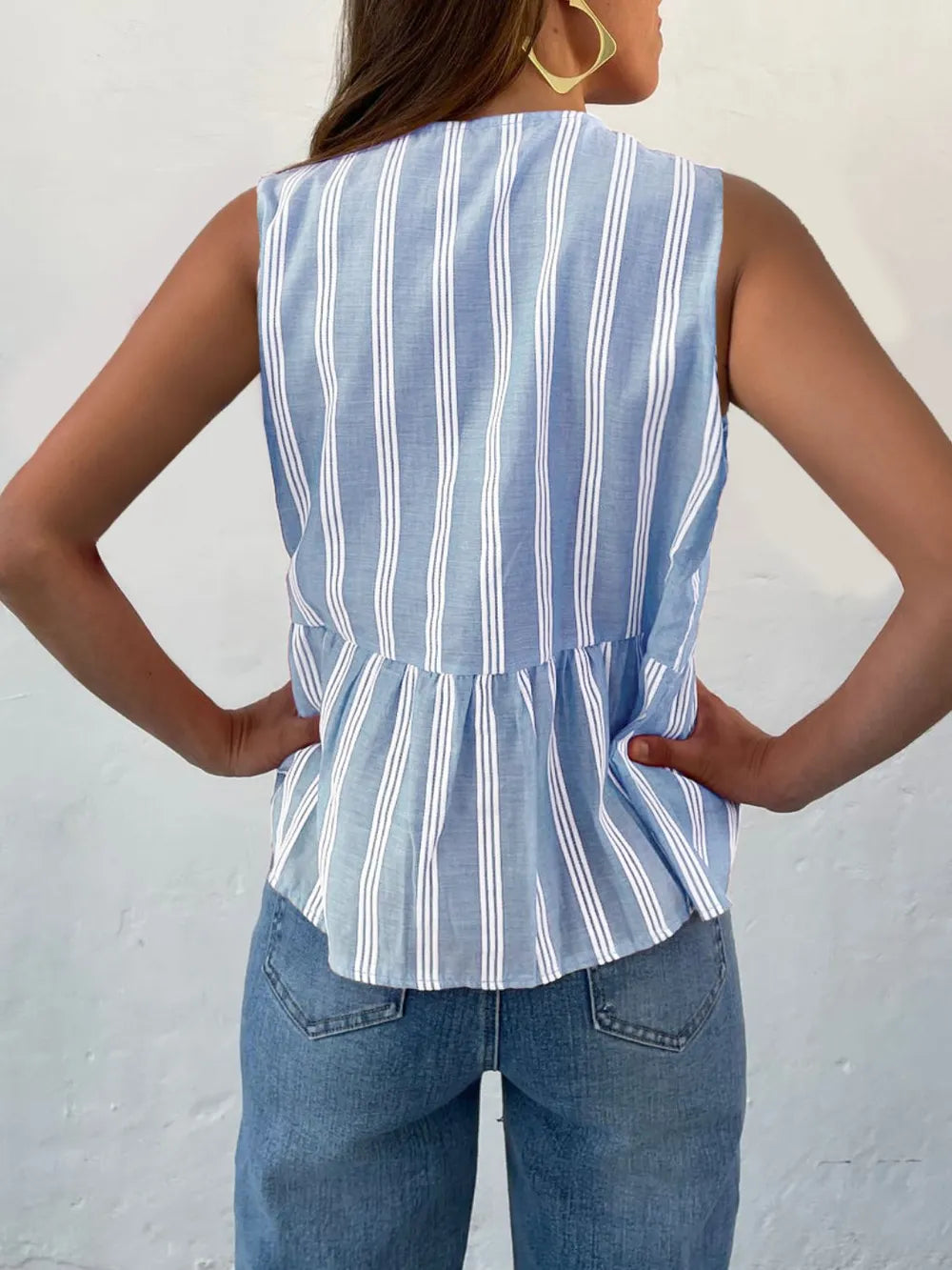 Striped tank top with tie hem styled with white jeans