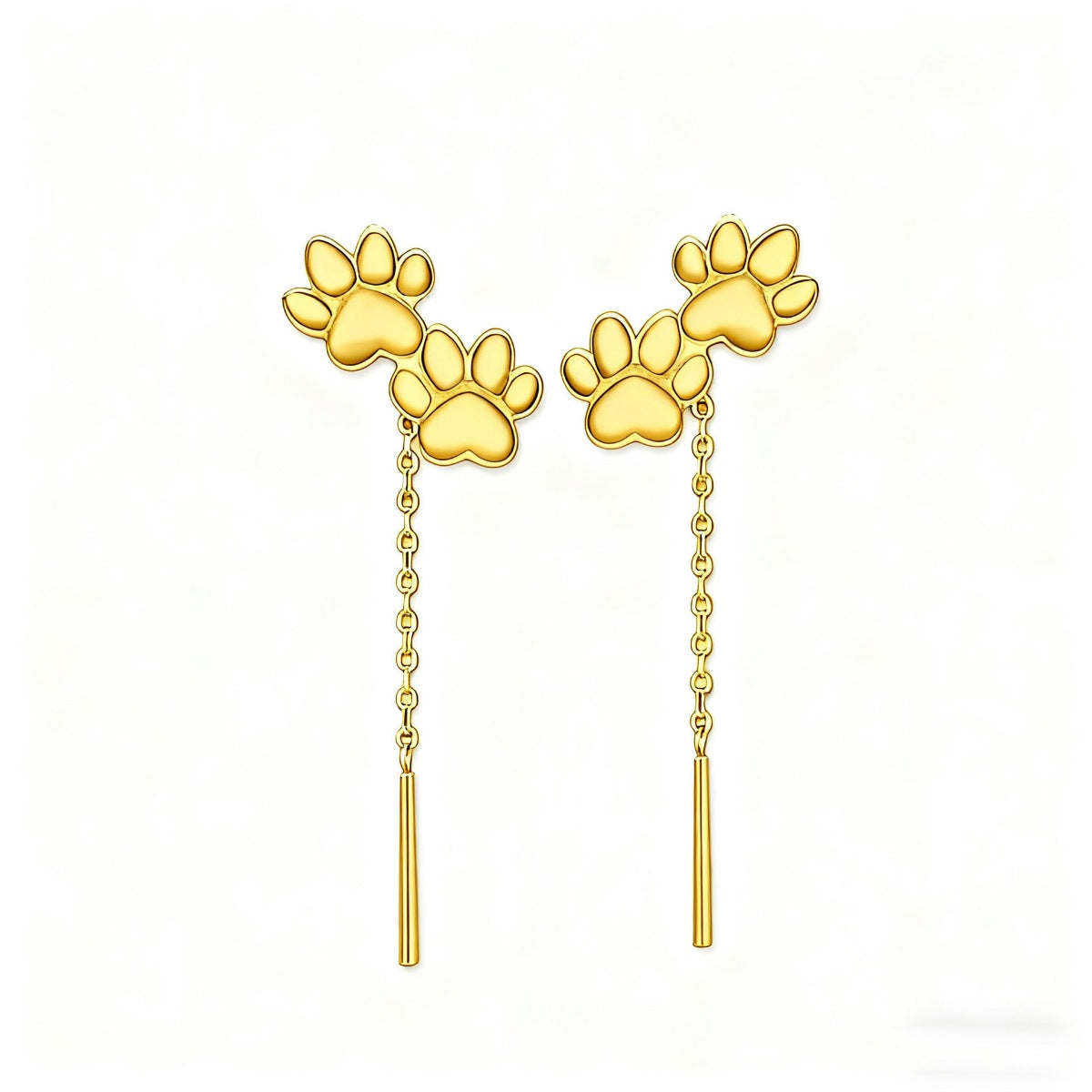 Paw drop earring worn to show the length on the ear