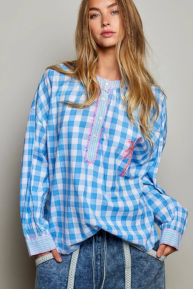 Blue gingham blouse with embroidered palm tree motifs