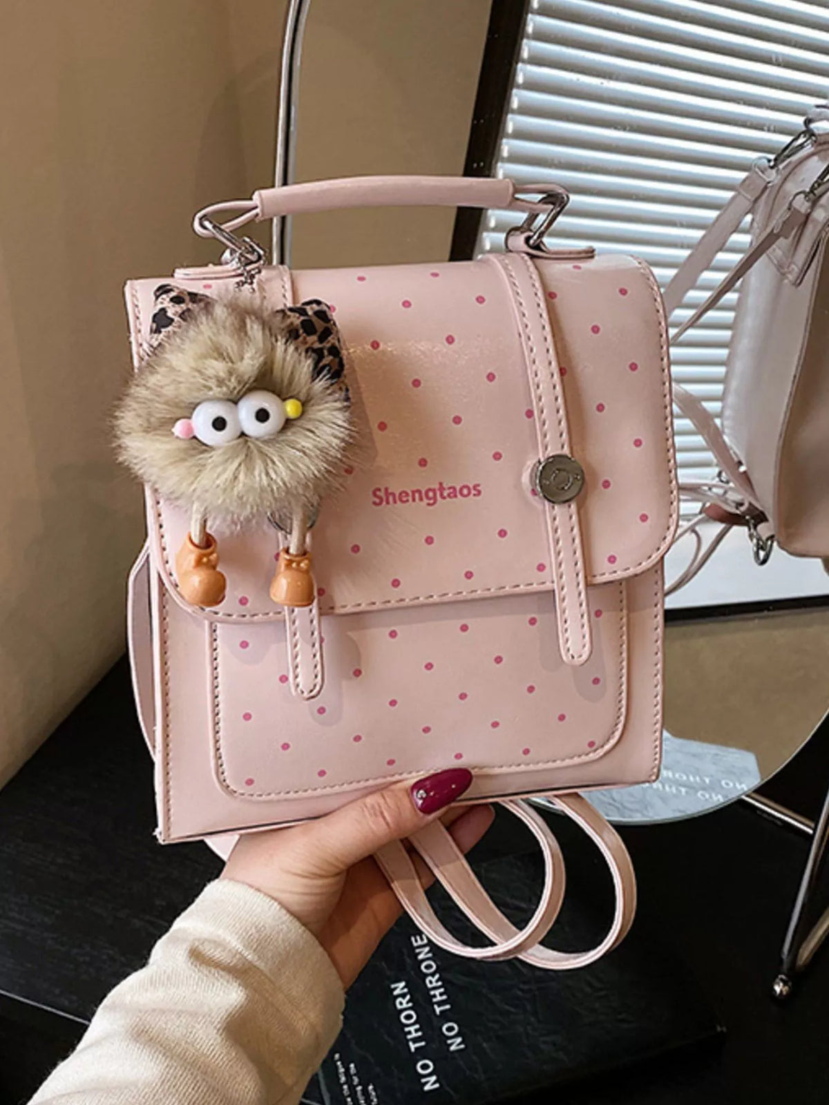 Blush pink polka dot mini backpack interior compartment