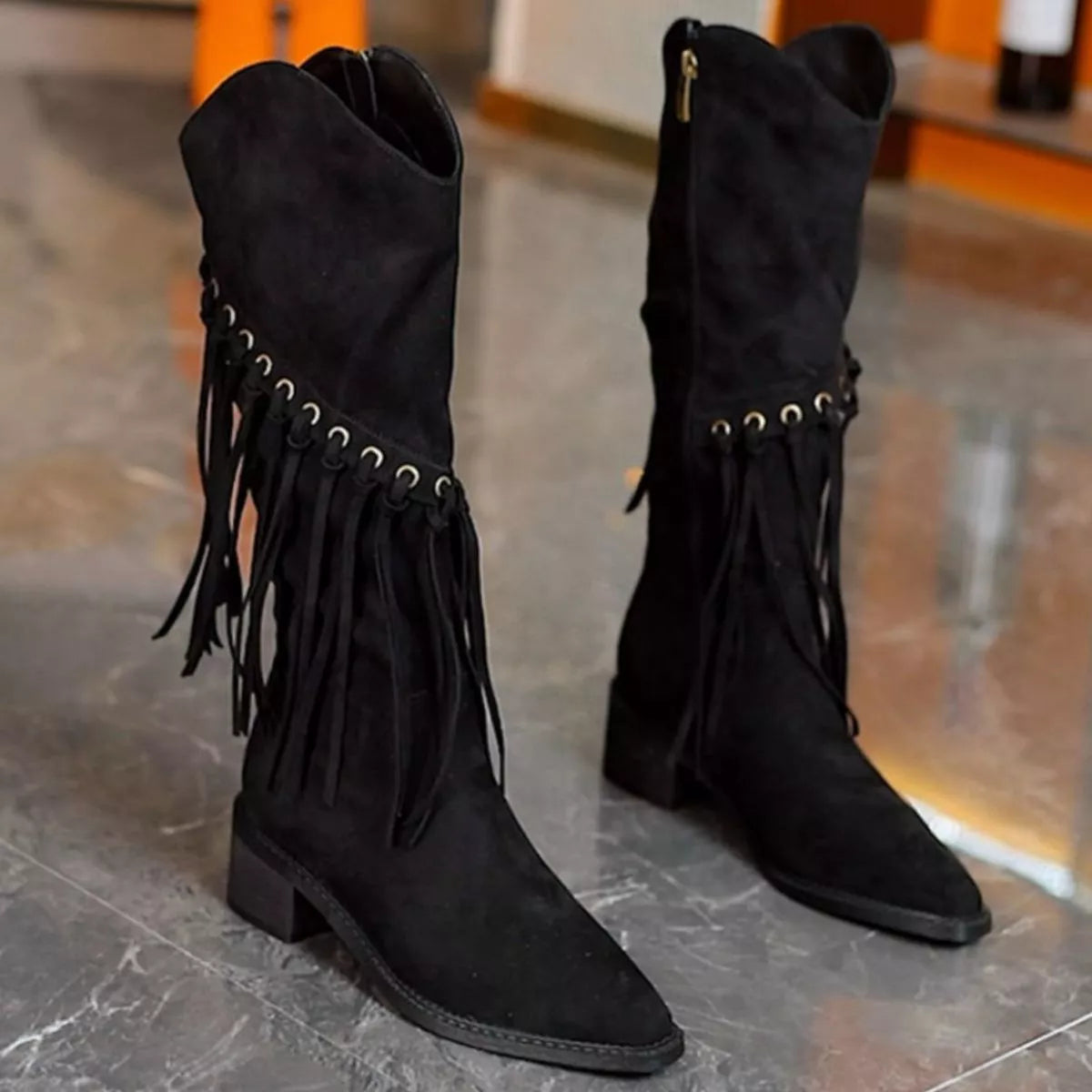 Fringed pointed toe block heel boots angled pair