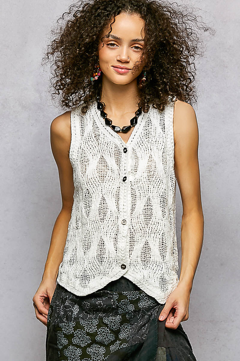 Crochet v neck vest styled over a tank