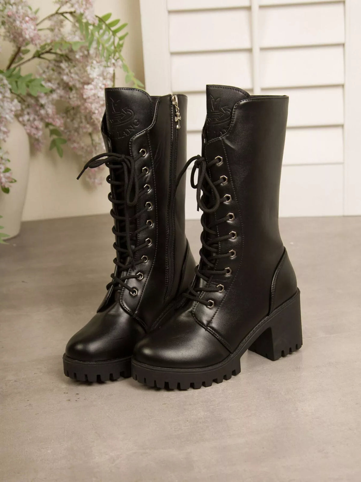 Black lace up block heel boots heel detail