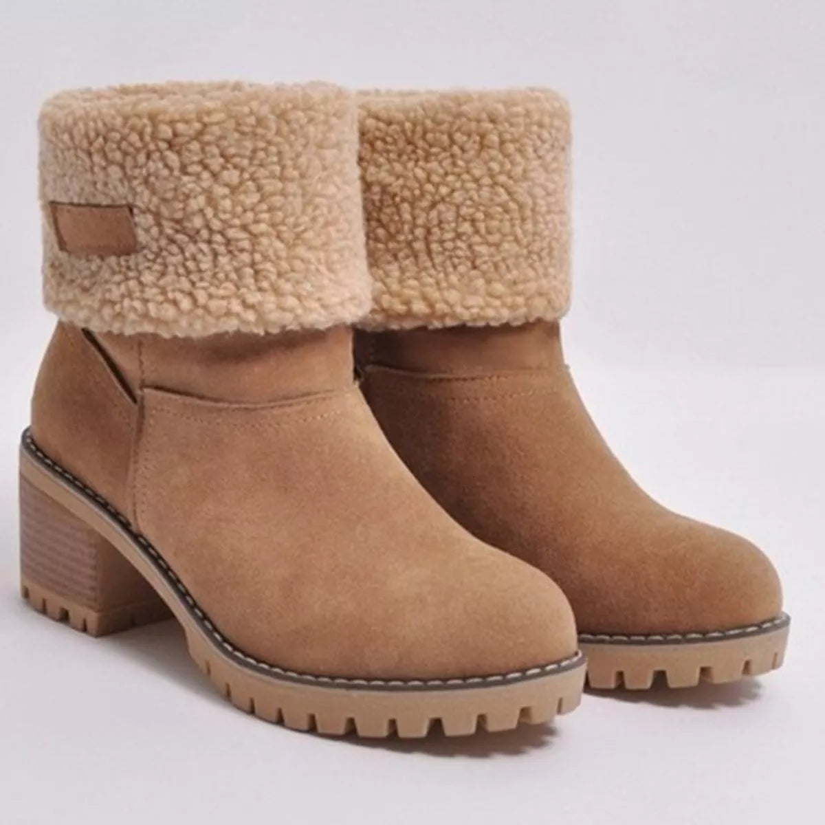 Suede round toe block heel boots worn with denim