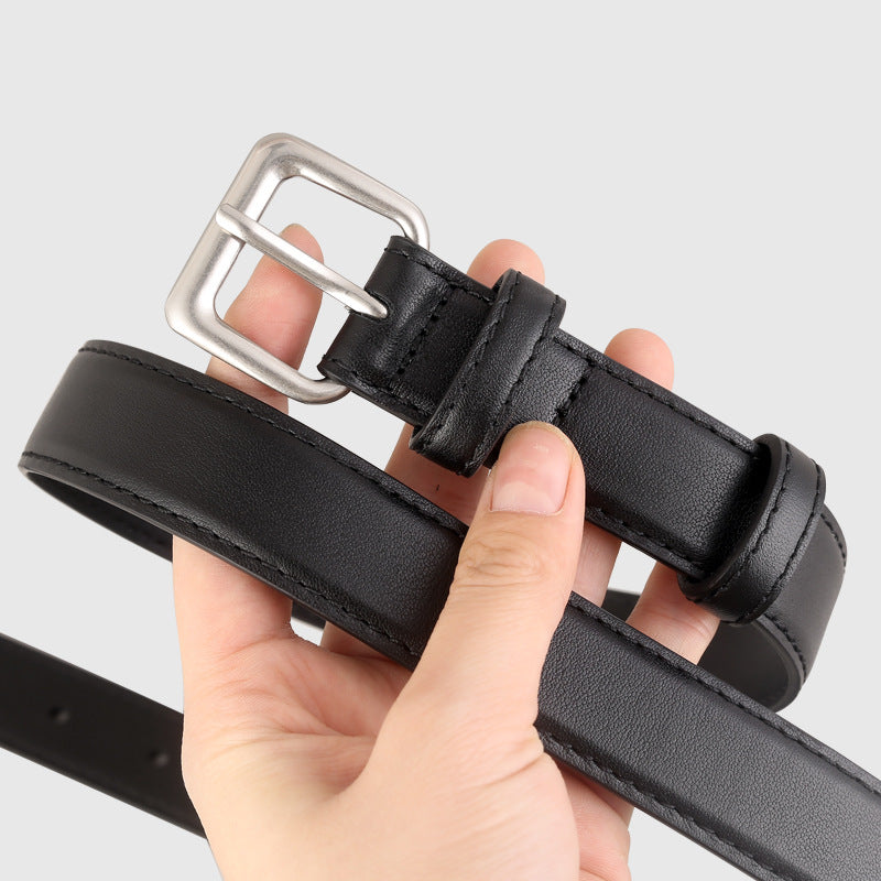 Classic leather belt with silver buckle coiled