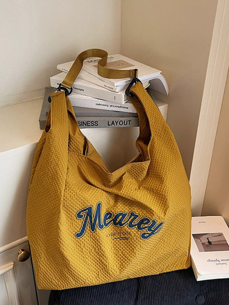 Nylon casual shoulder bag in yellow front view