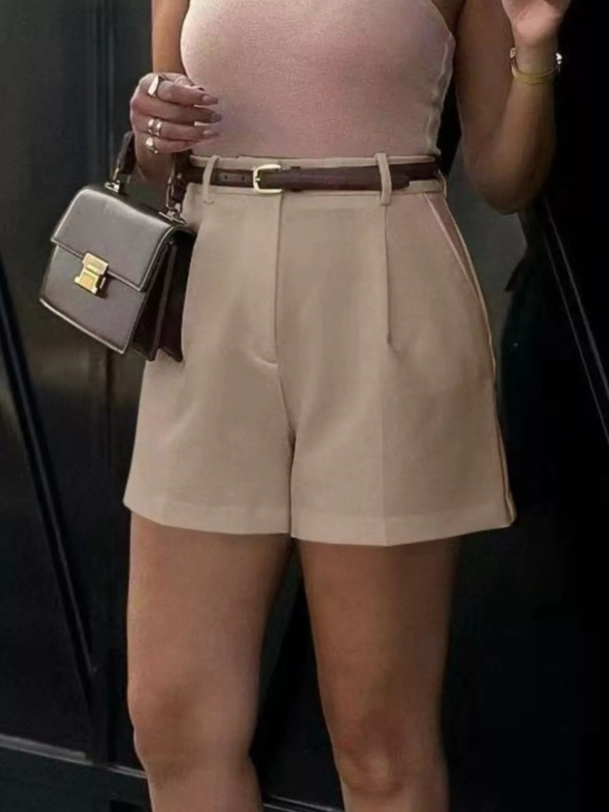 Pleated shorts styled with a fitted tee