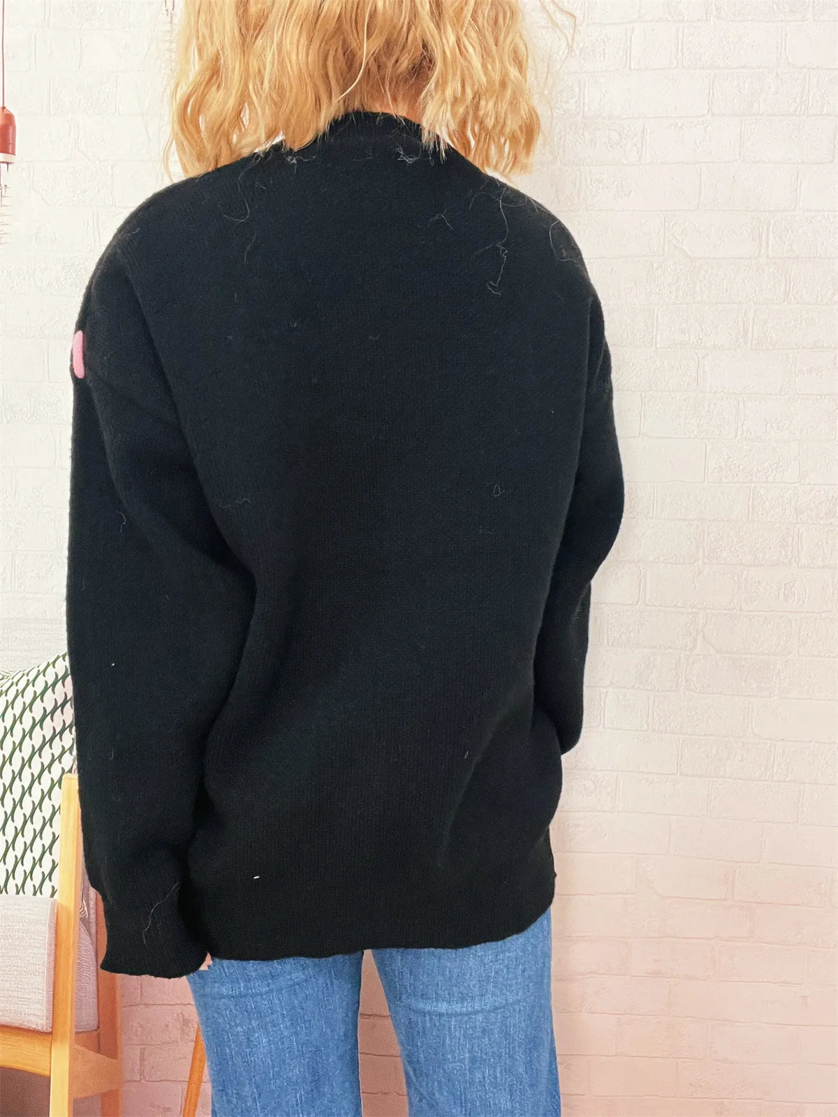 bear applique round neck sweater fabric detail close up