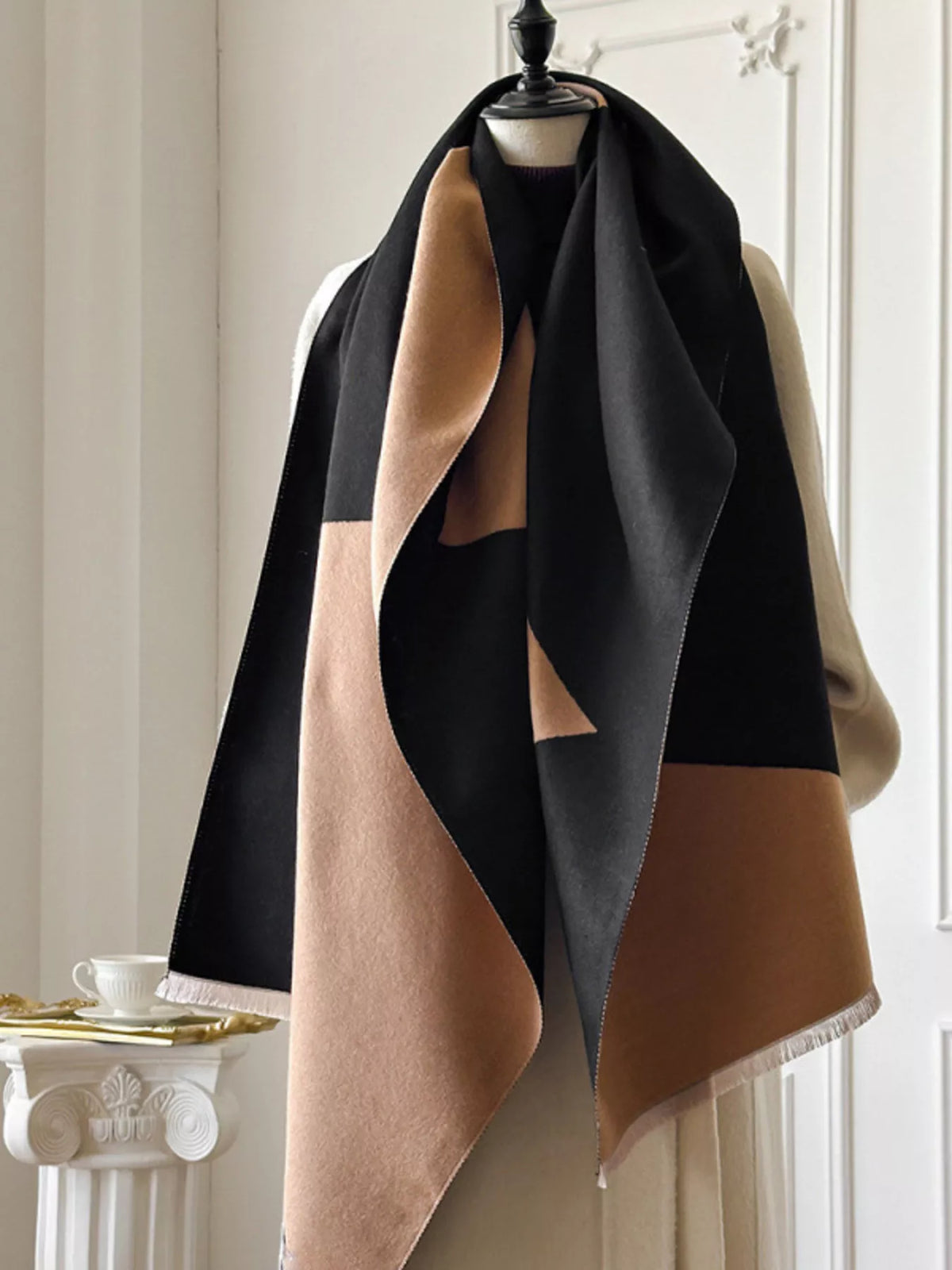 Close up of the raw hem detail on the scarf