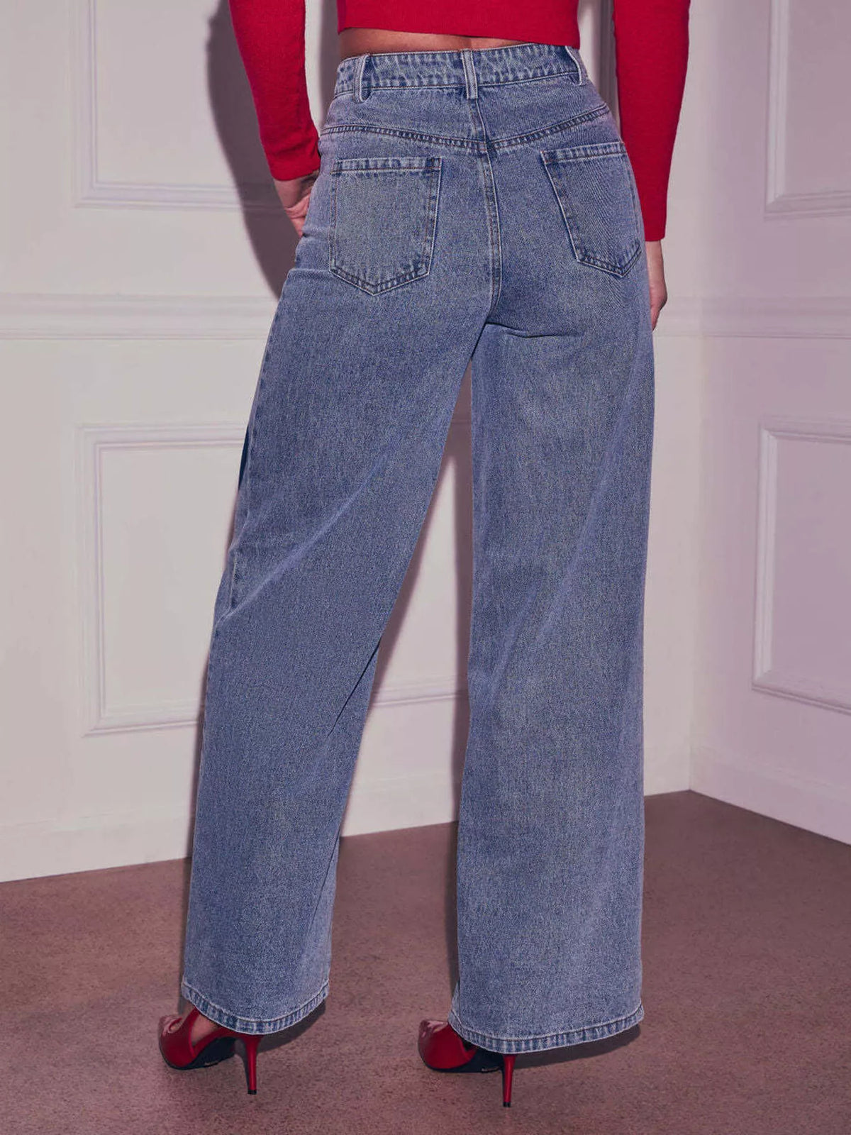Model wearing heart high waist jeans