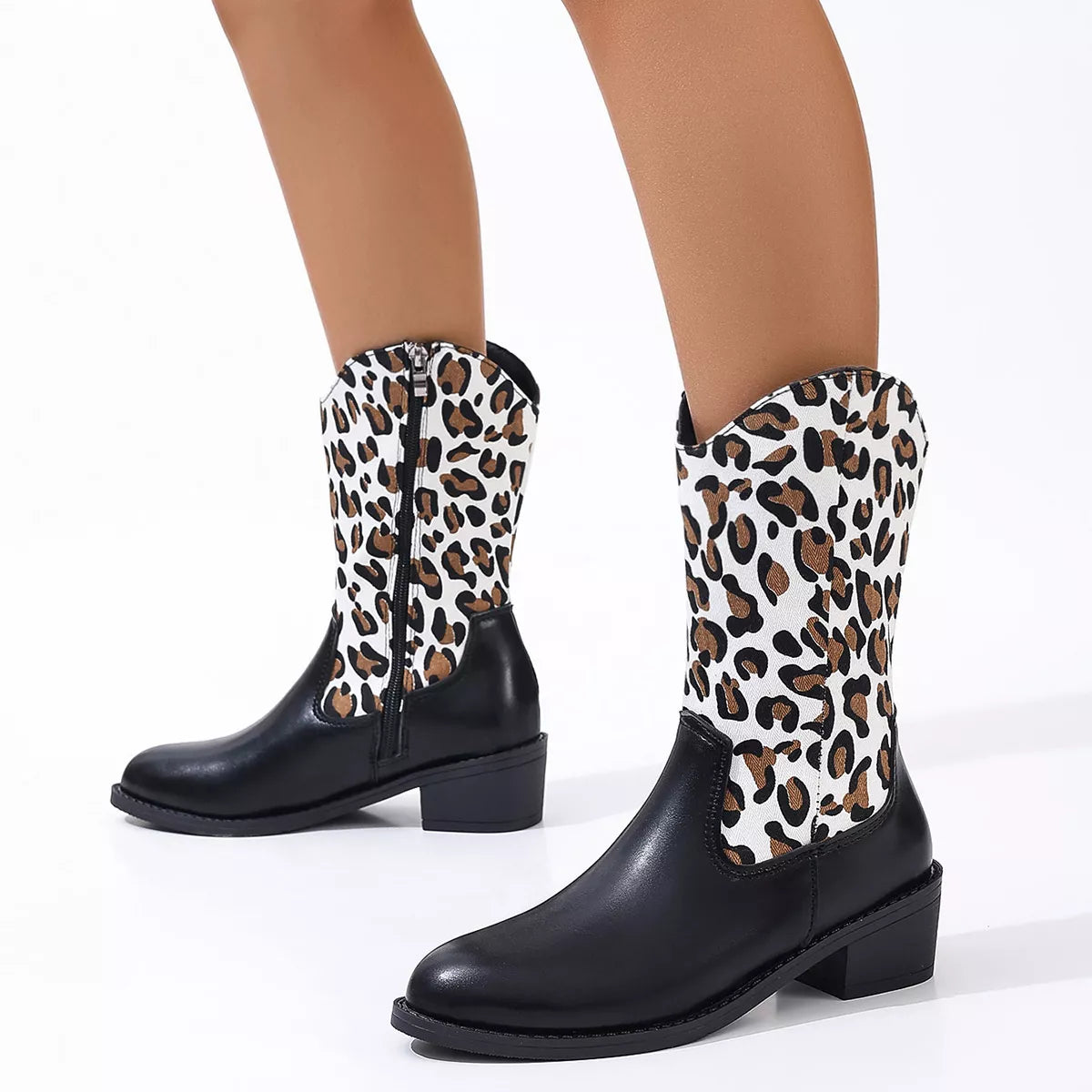 Point toe block heel boots angled three quarter view