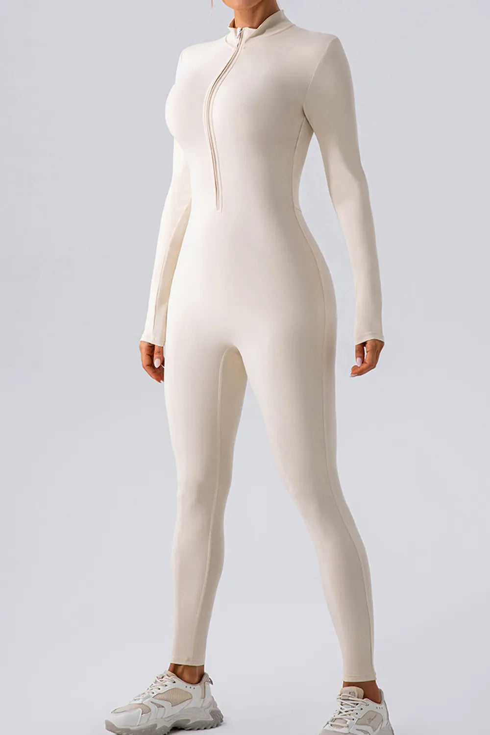 Half zip mock neck active jumpsuit model wearing