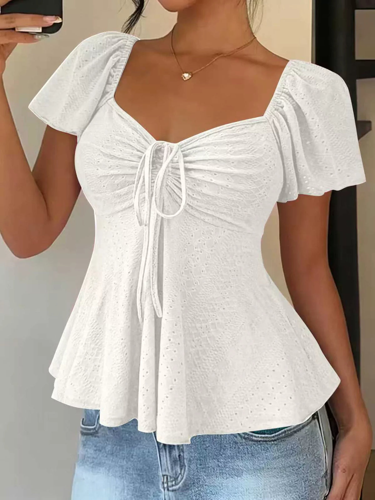 Flutter sleeve top shown from the side