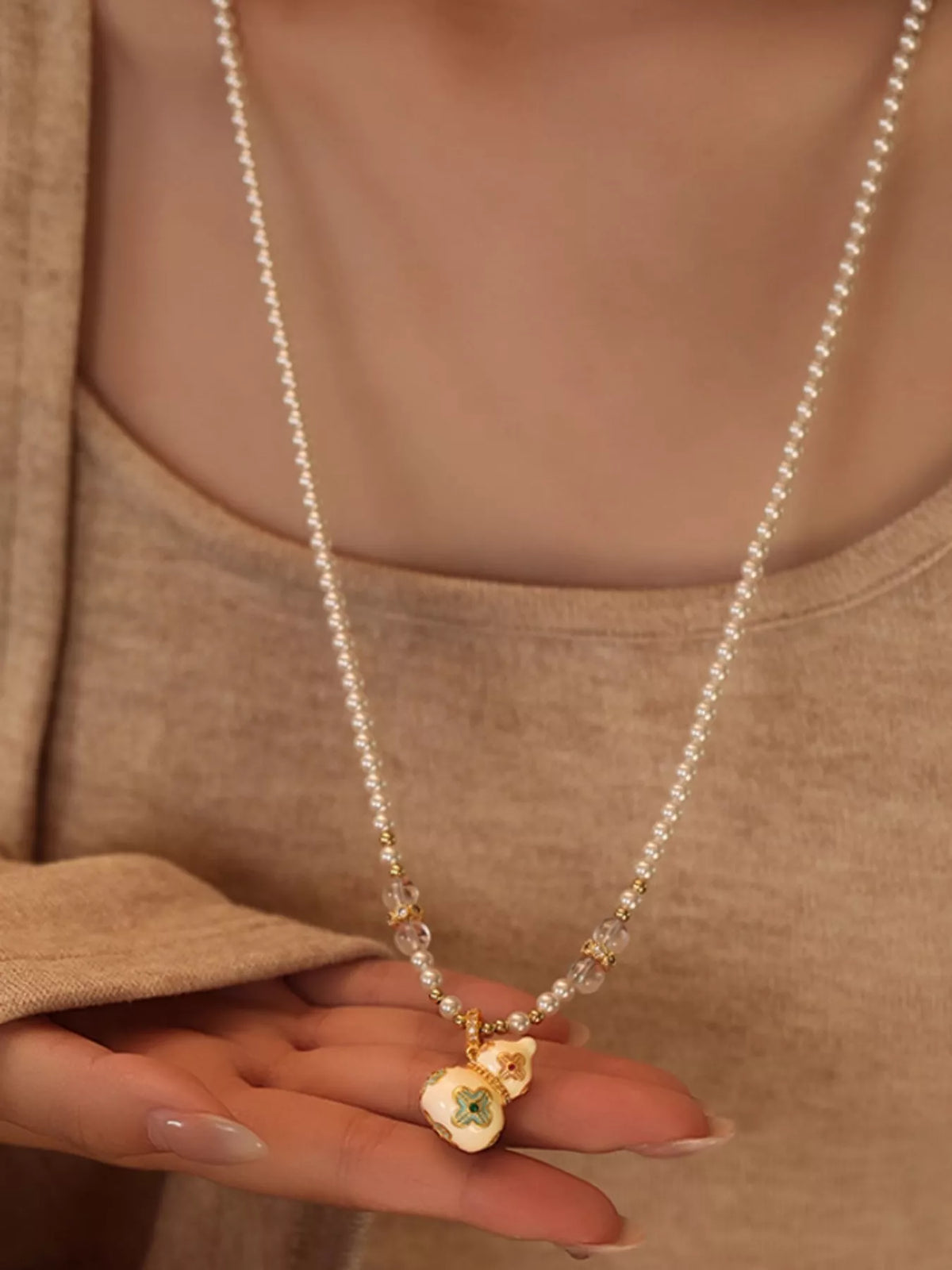 gold plated gourd pendant necklace close up detail