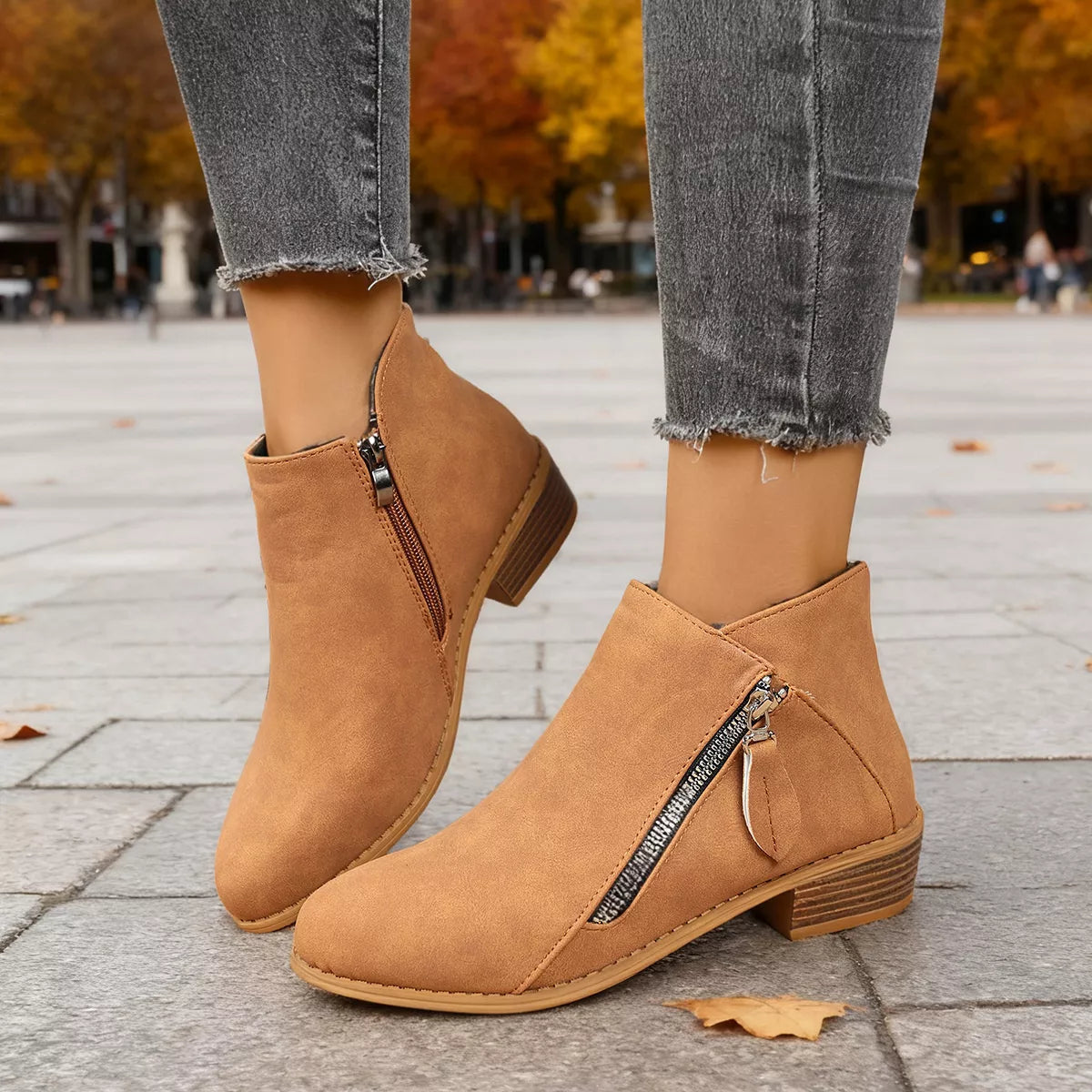 Side zip block heel boots worn walking