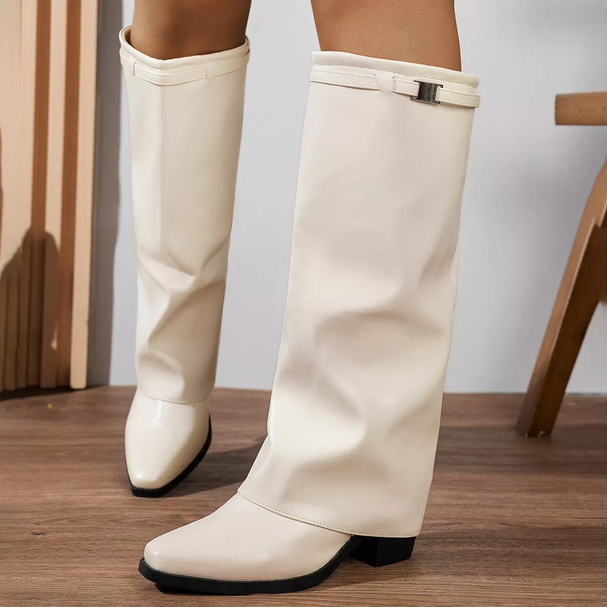 Knee high block heel boots styled on model