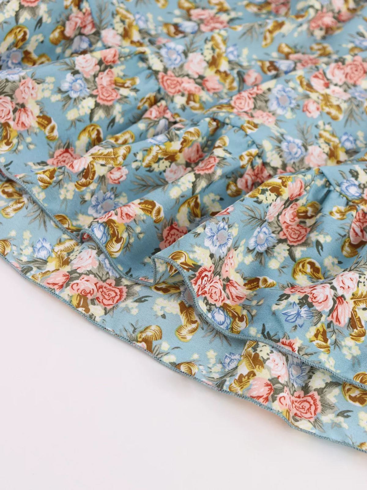 Sea blue floral halter neck mini dress close up detail