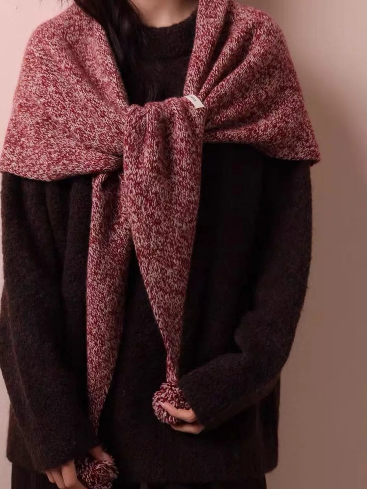 Detail of the soft wool knit and pom pom finish