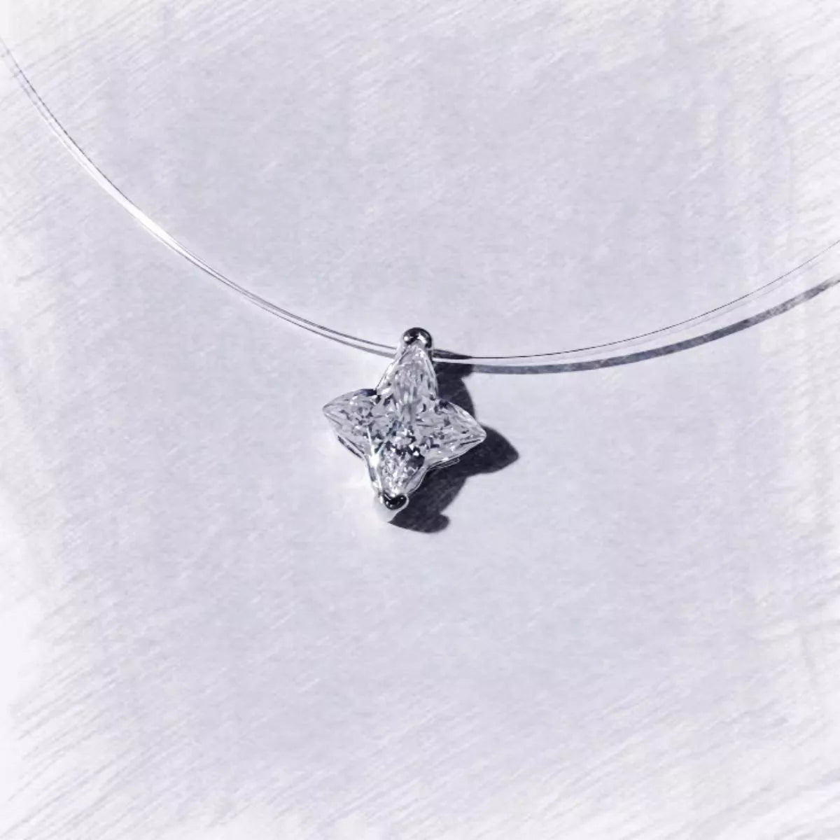 Star pendant with 2 carat moissanite stone close up
