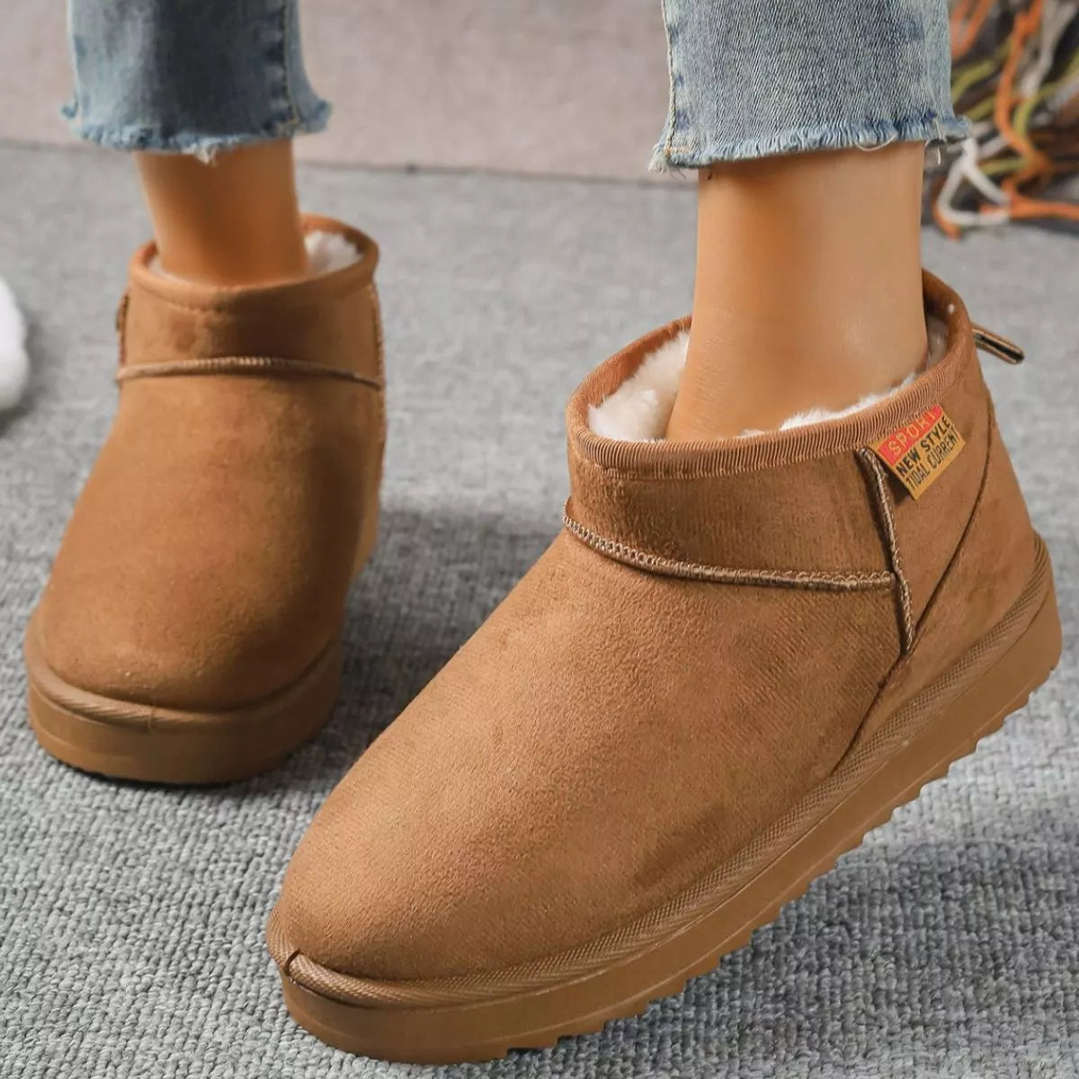 Beige round toe platform boots back heel view