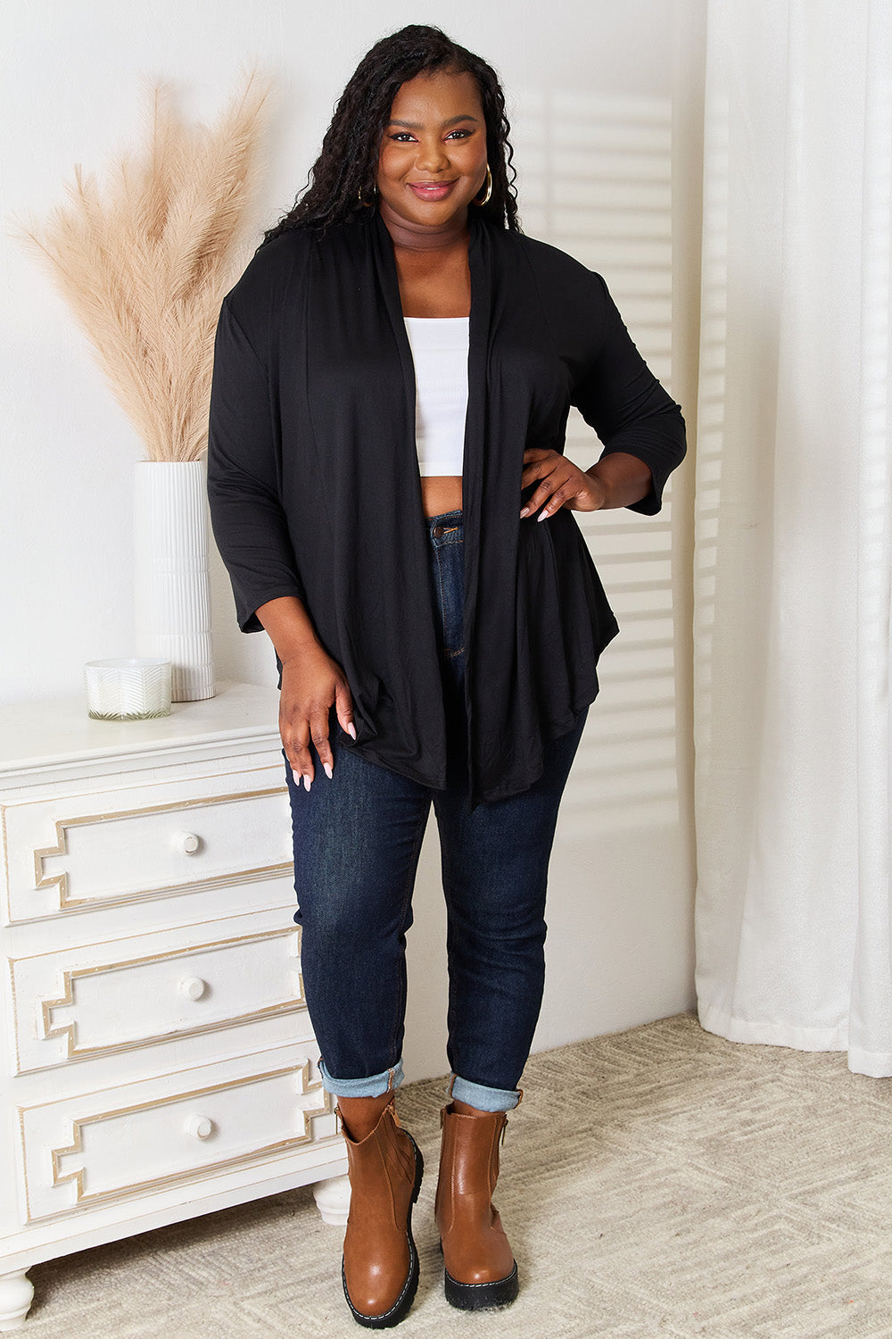 Back view of black draped cardigan