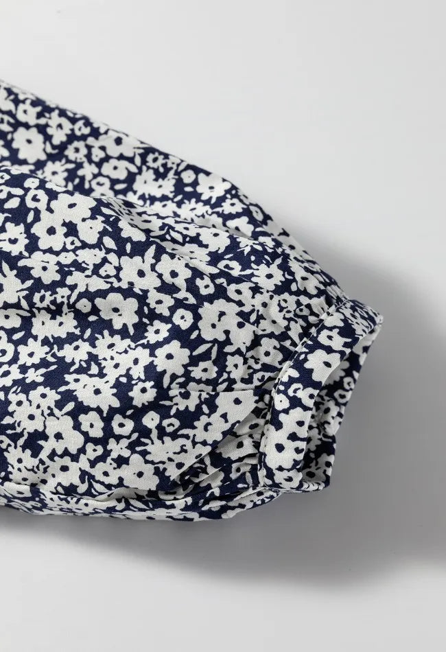 Floral print blouse styled with jeans
