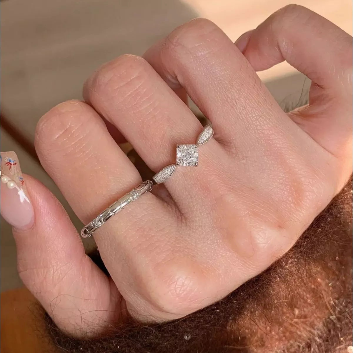 Geometric ring shown worn on the hand