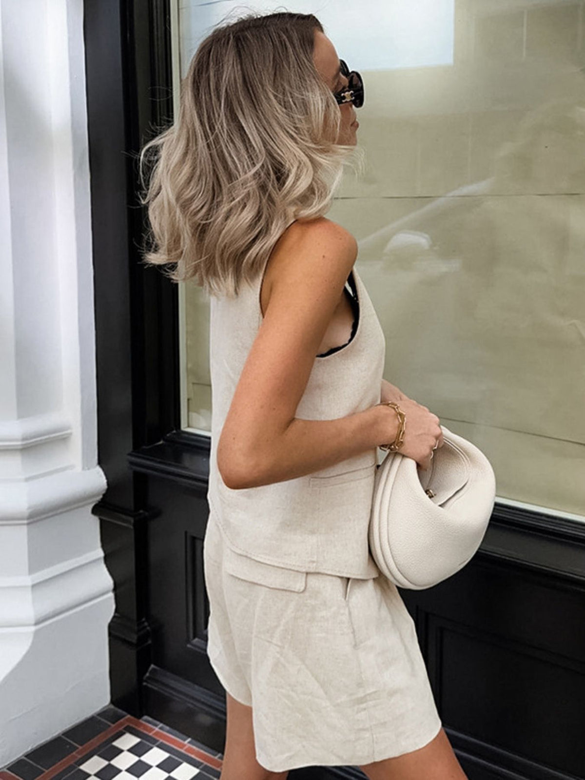 Matching beige vest and shorts back view