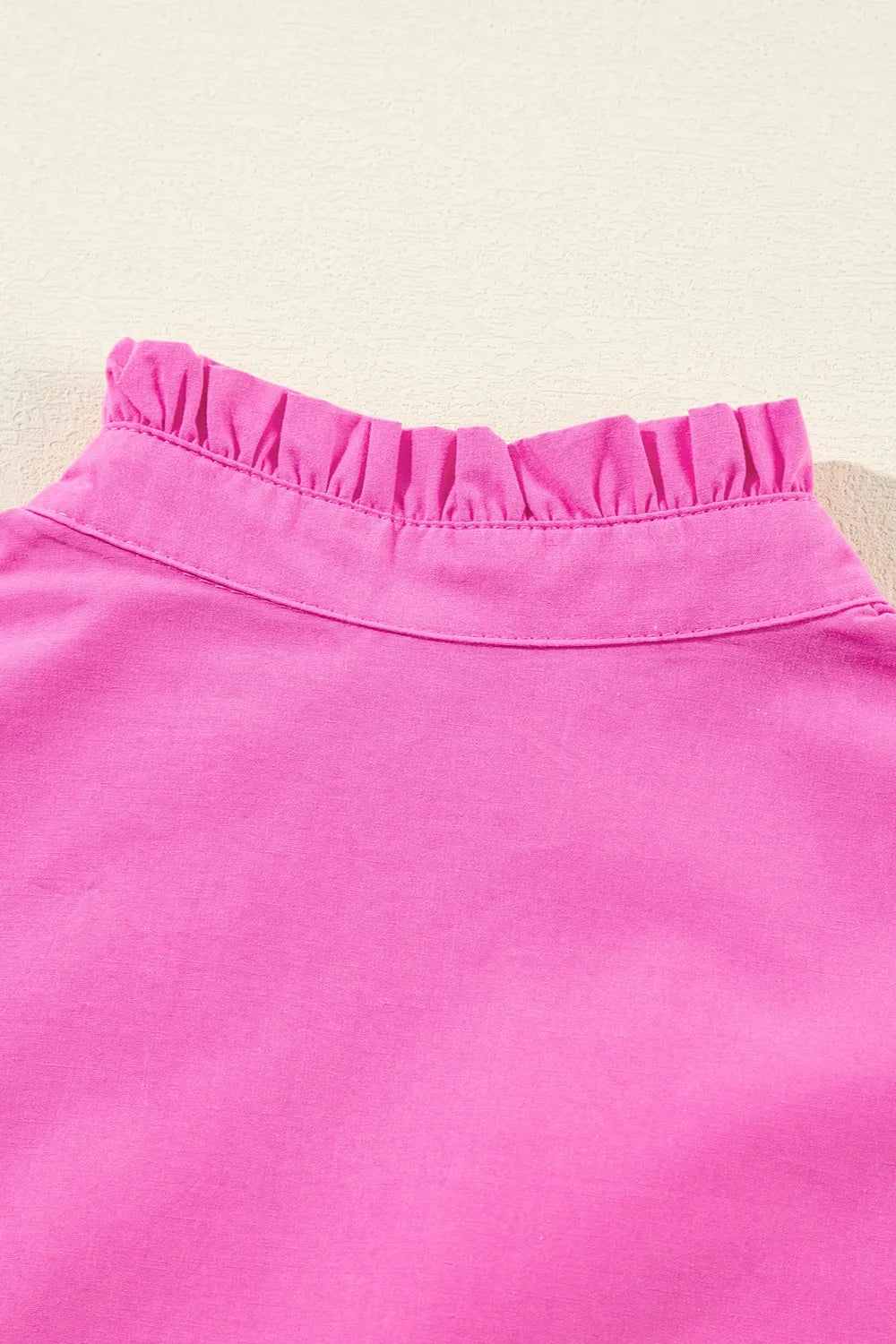 Ruffled mini dress neckline close up