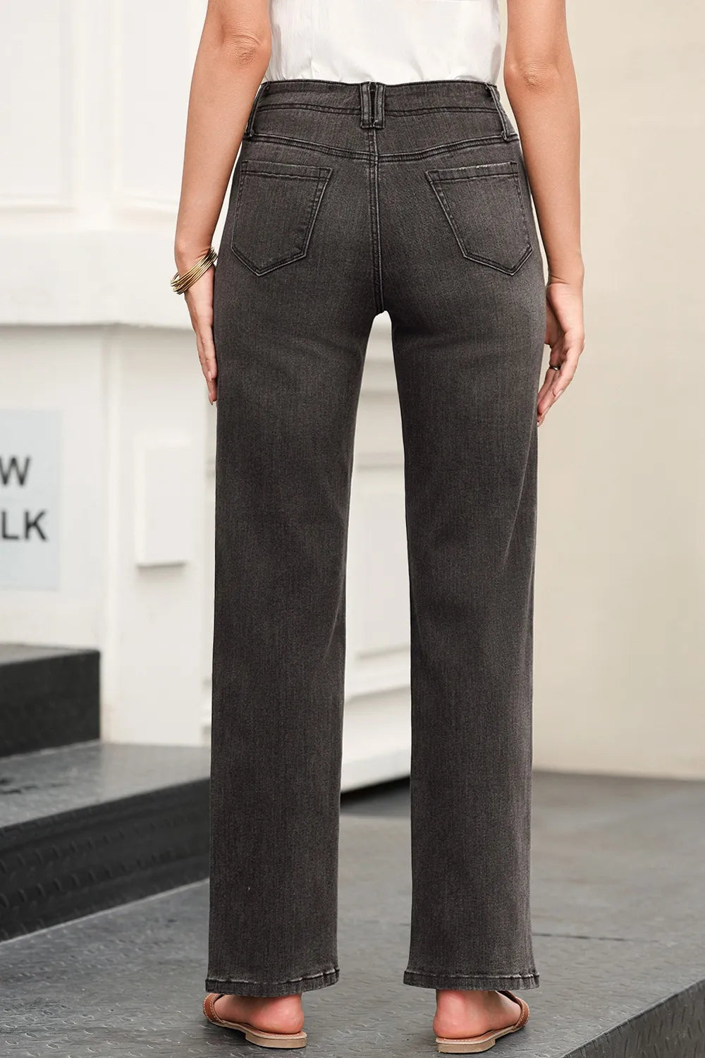 Back view of high waisted wide leg jeans with pockets