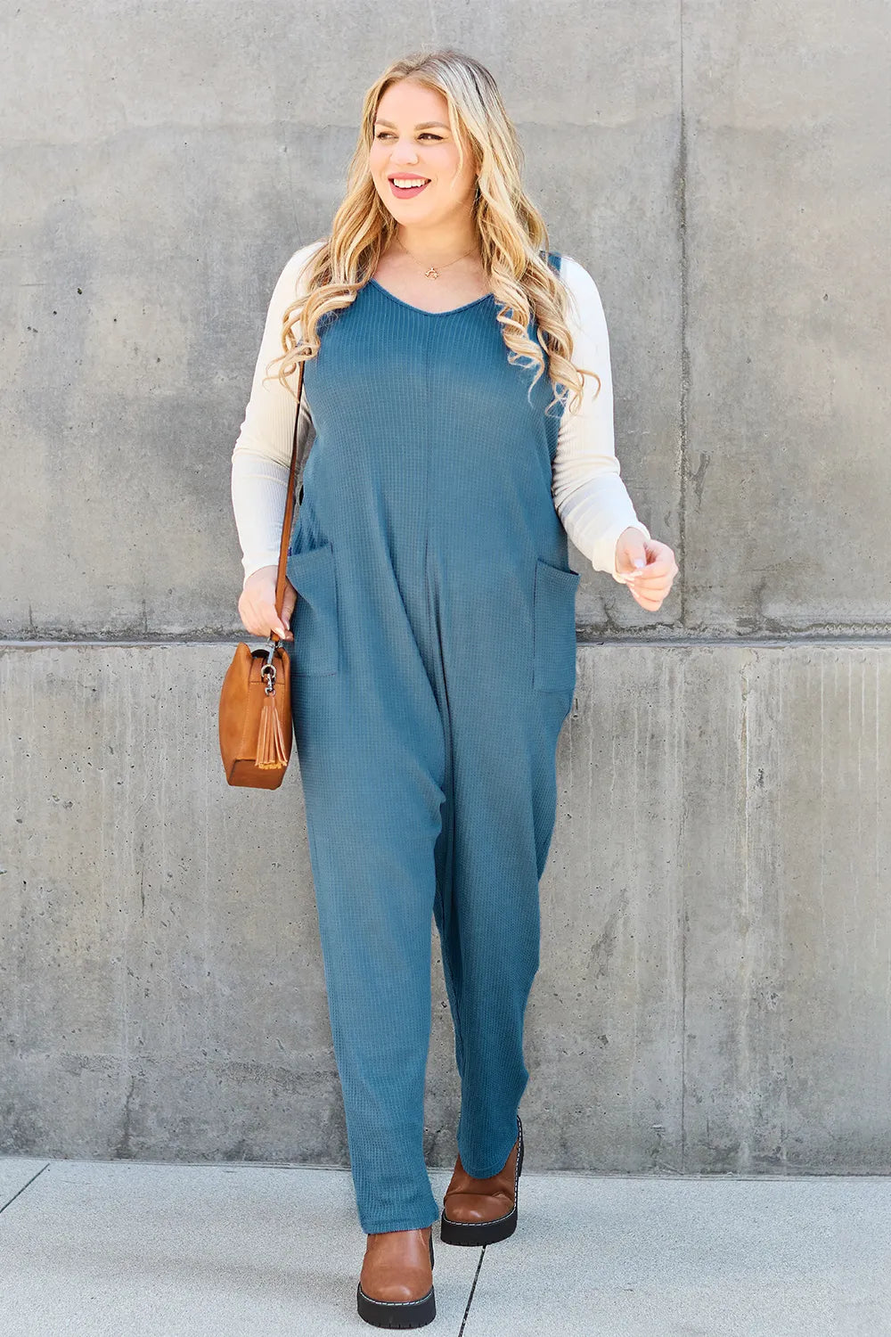 Sleeveless jumpsuit pocket detail