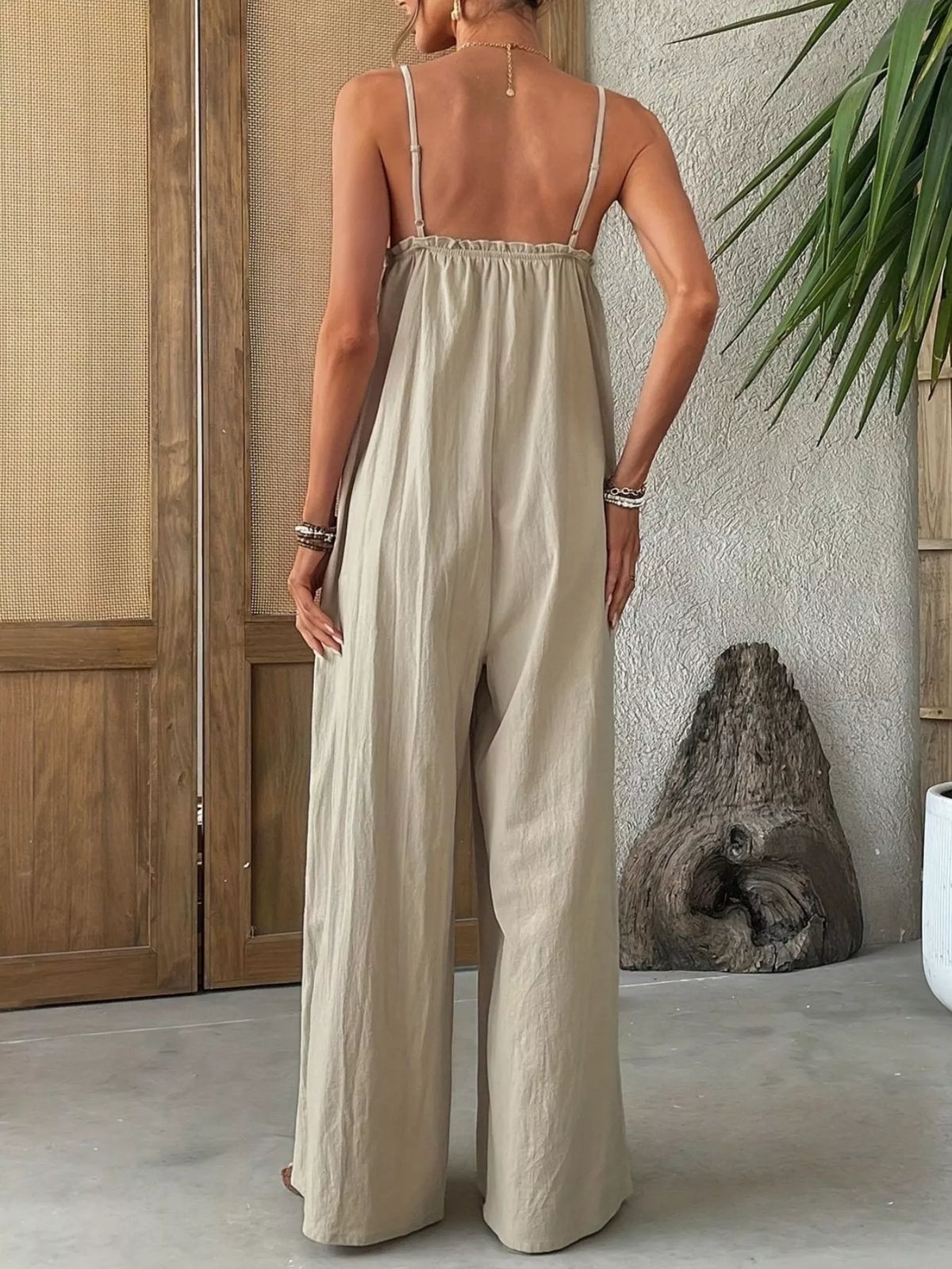 khaki sleeveless wide leg jumpsuit styled on model
