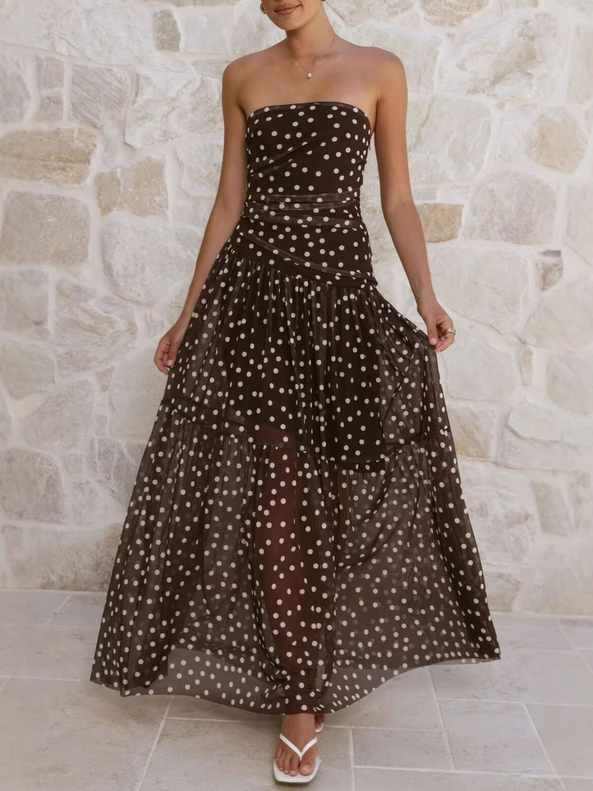 Polka dot strapless ruched maxi dress, seated styling view