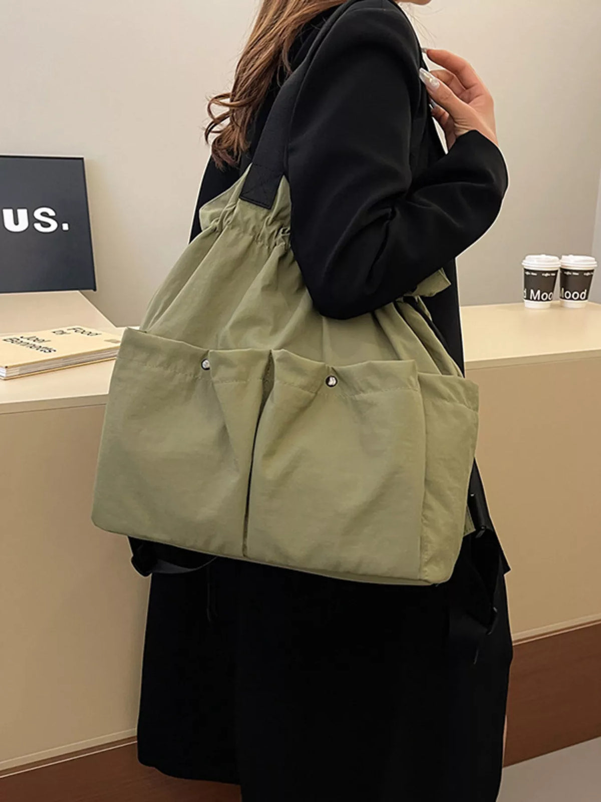 Drawstring nylon backpack shoulder strap detail