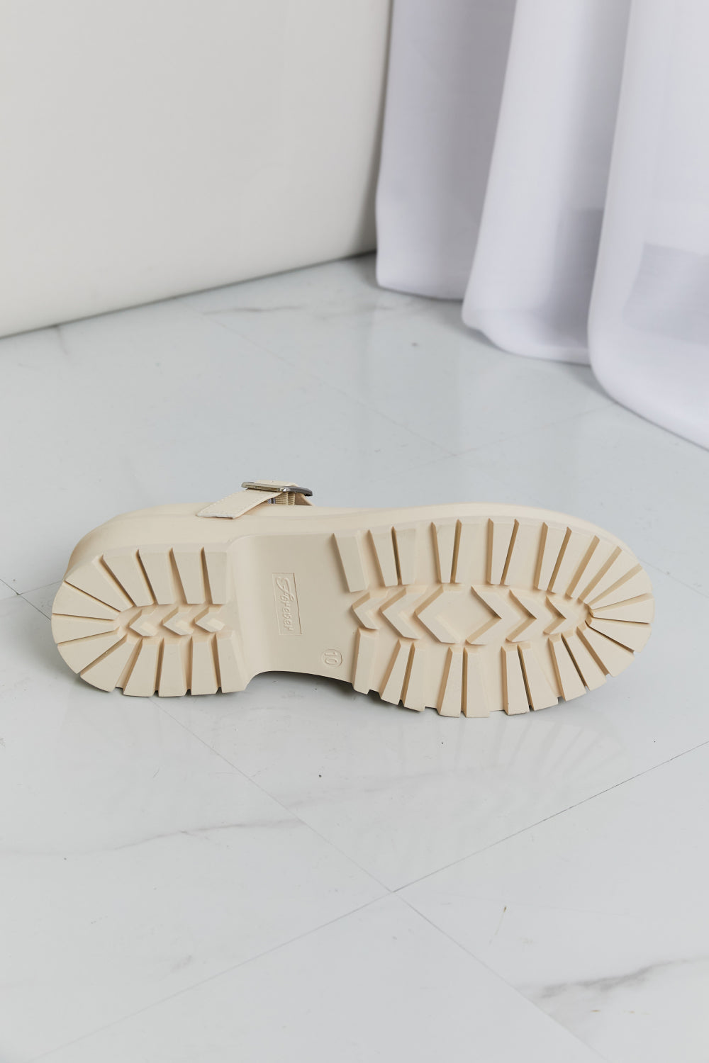 Platform Mary Janes shown as a pair from the front