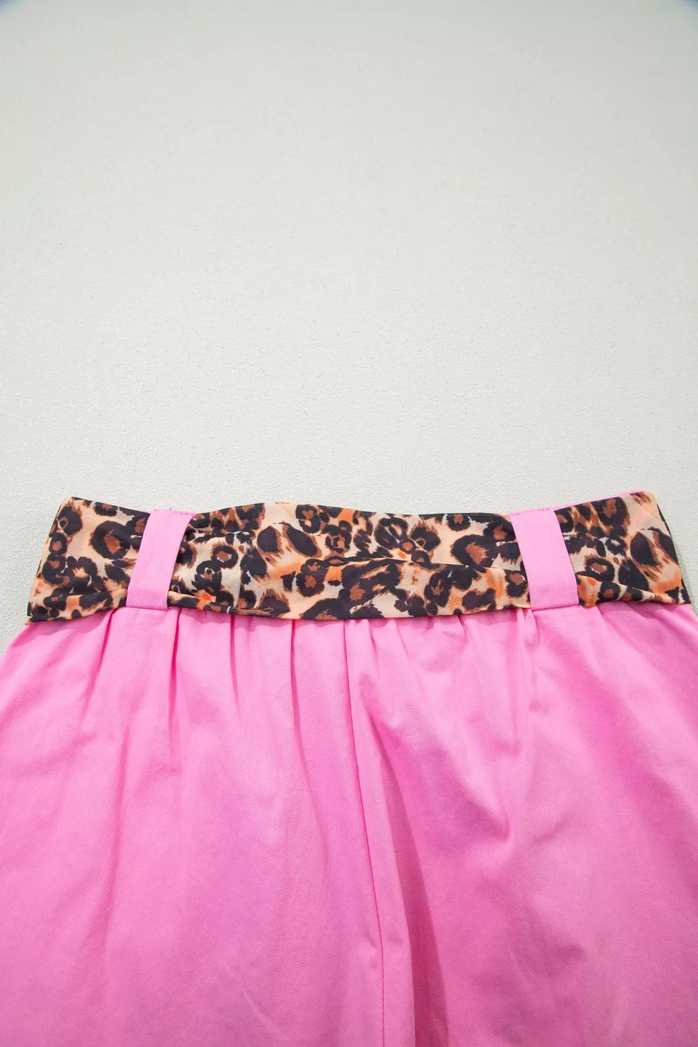 Fuchsia pink pleated wide leg shorts with leopard sash belt fabric detail