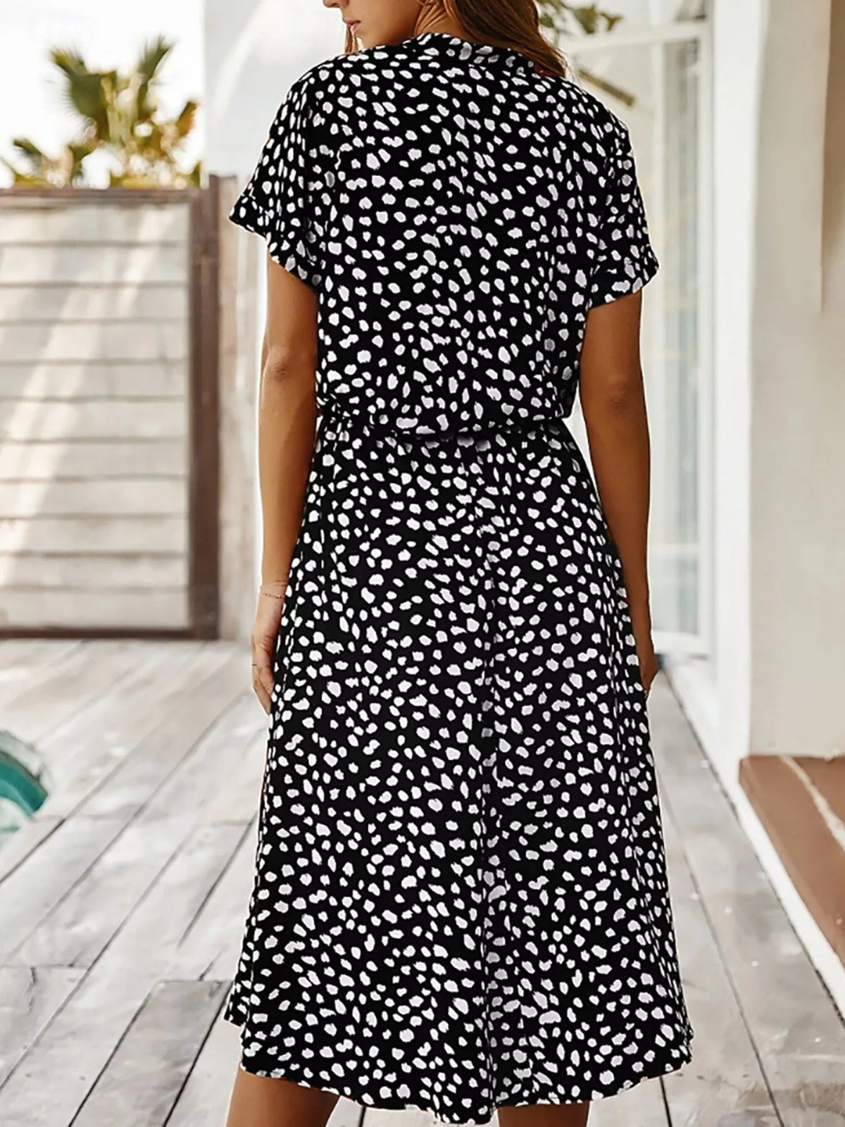 Polka dot button front midi dress side view