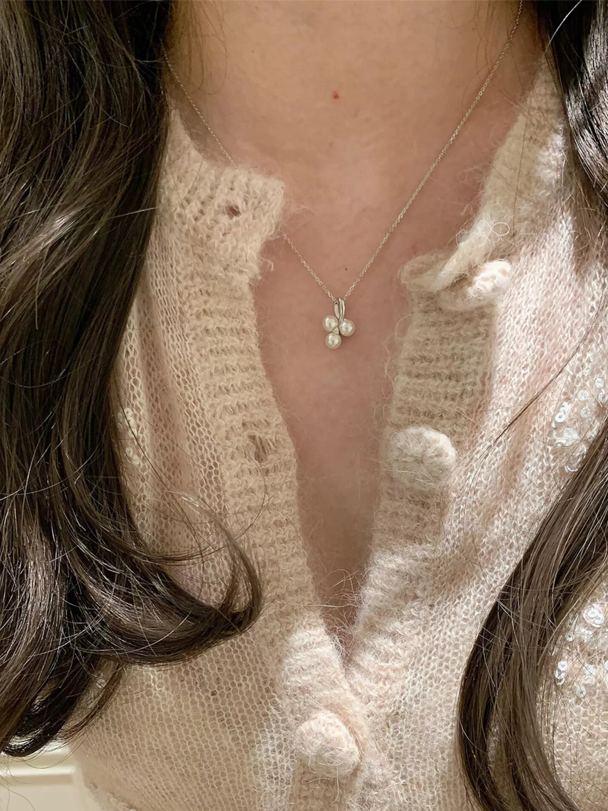 Pearl and zircon pendant close up