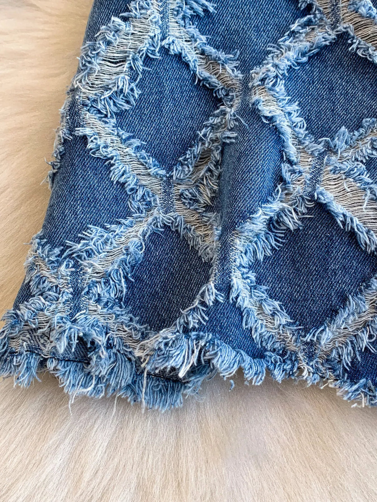 Denim jacket raw hem detail