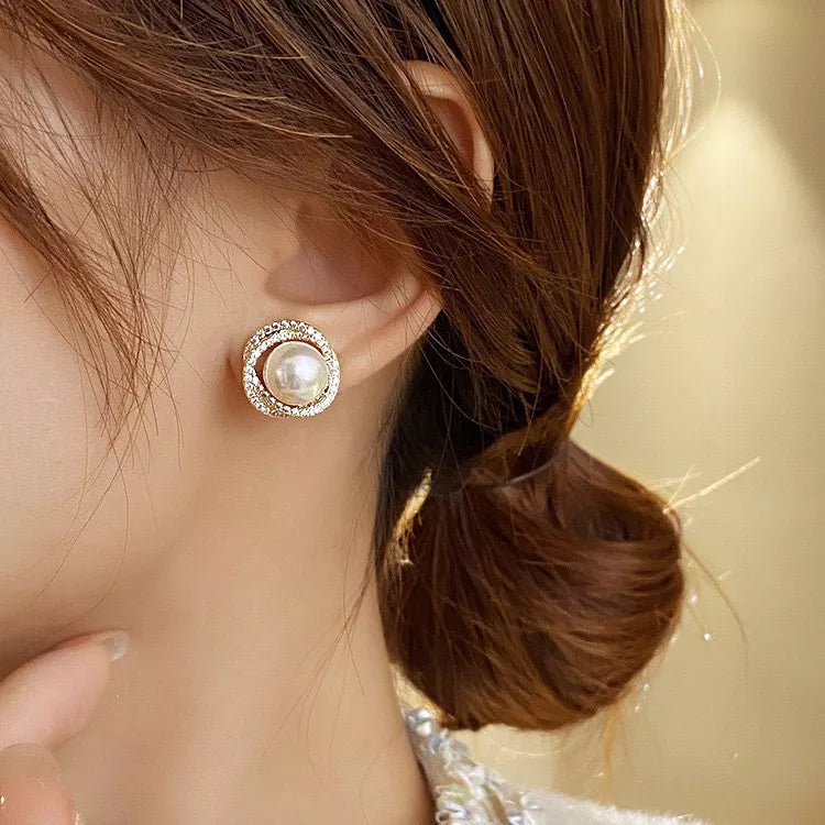 Pearl stud earrings silver close up